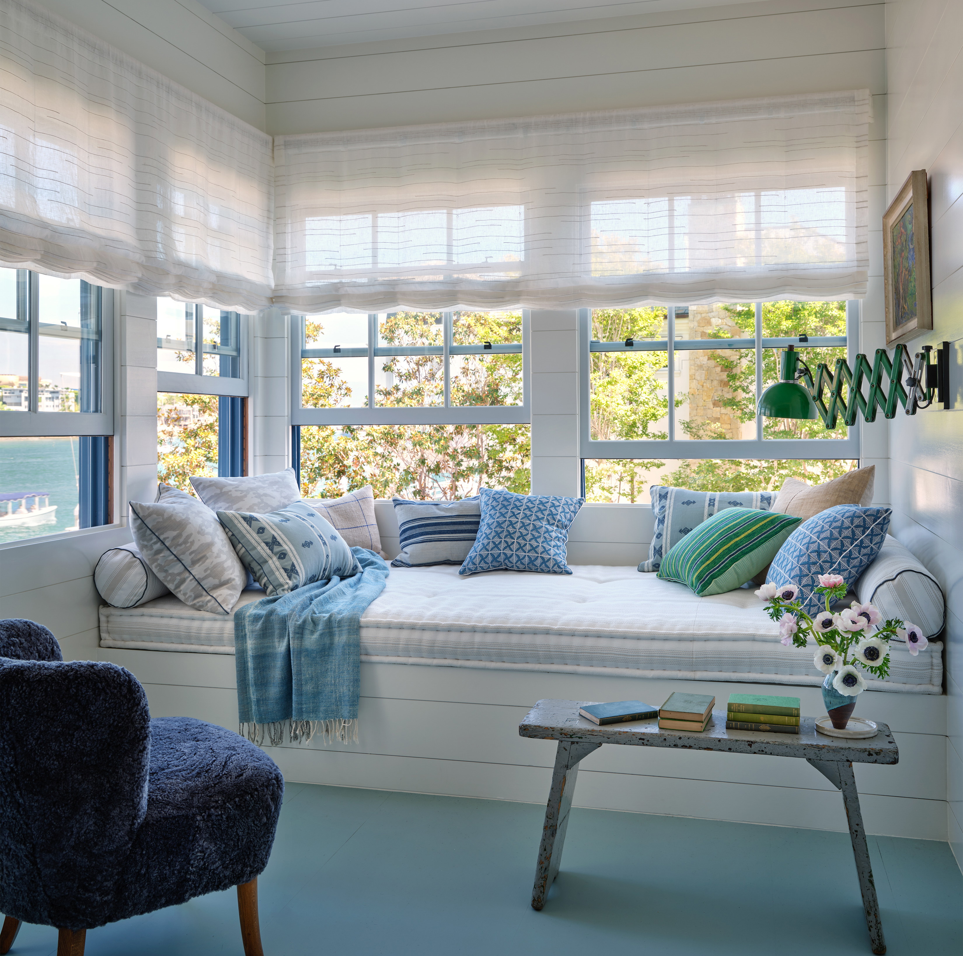 a living room filled with furniture and a window