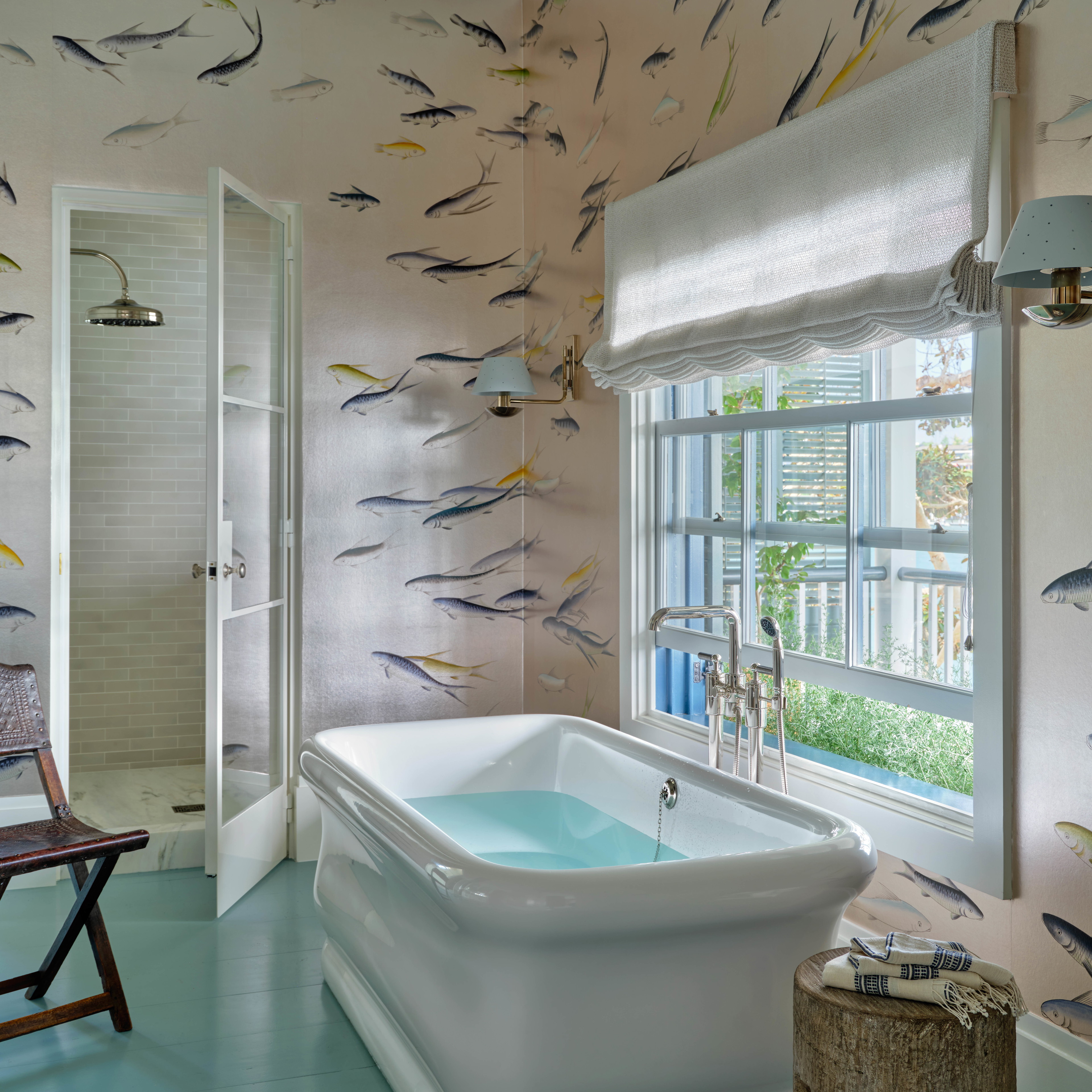 a bathroom with a tub and a window