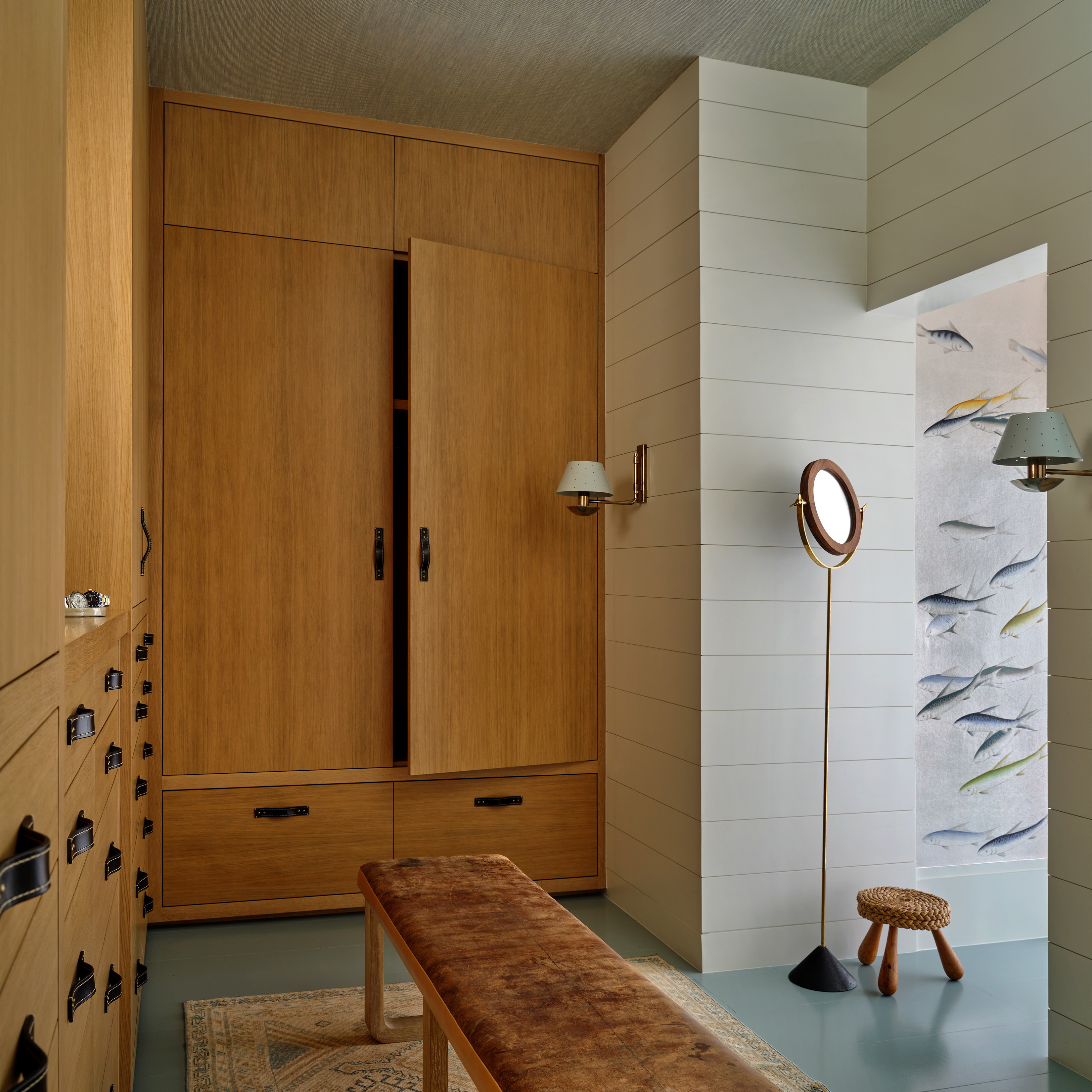 a room with a large wooden table and a lamp