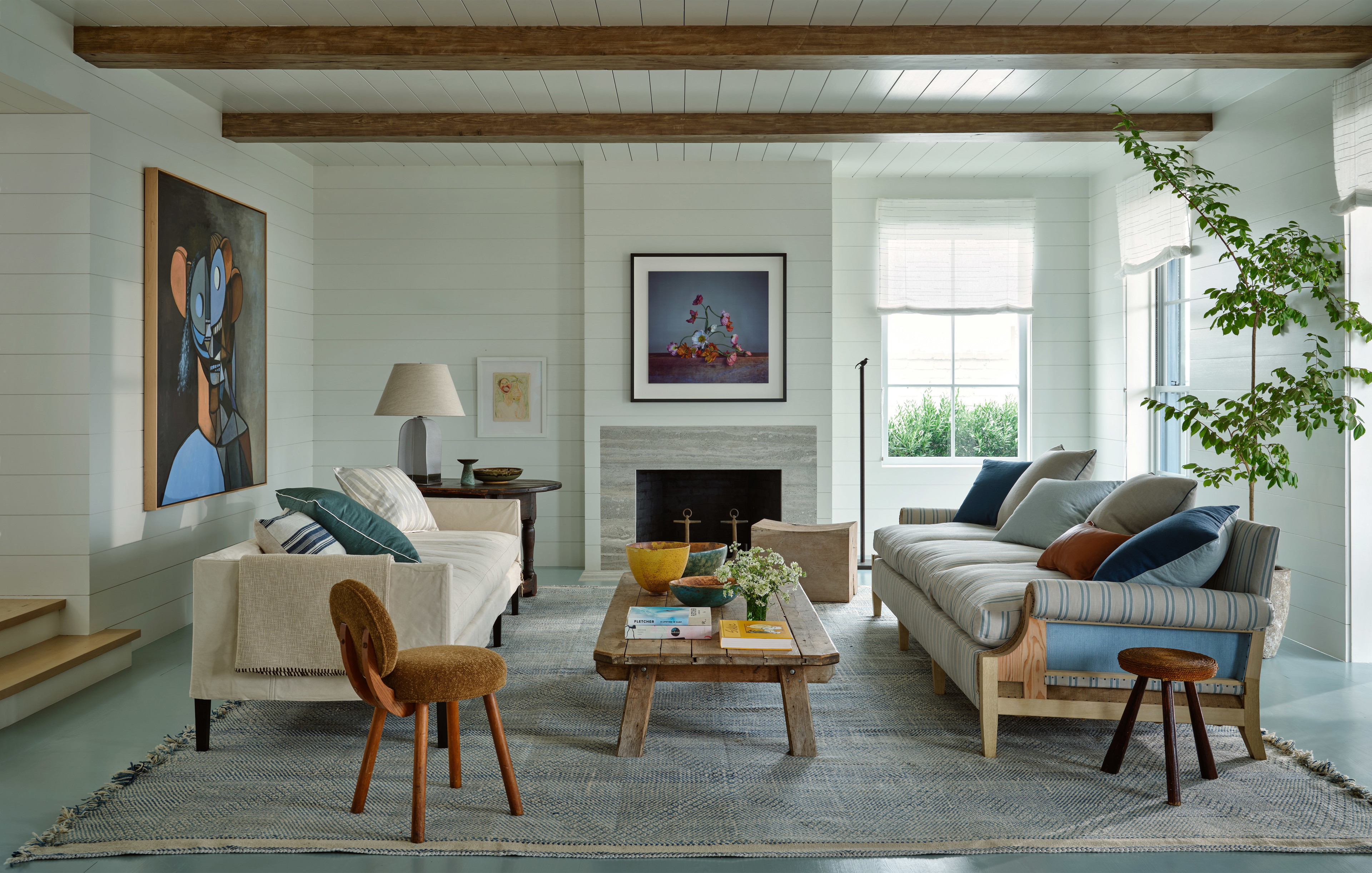 a living room filled with furniture and a fire place