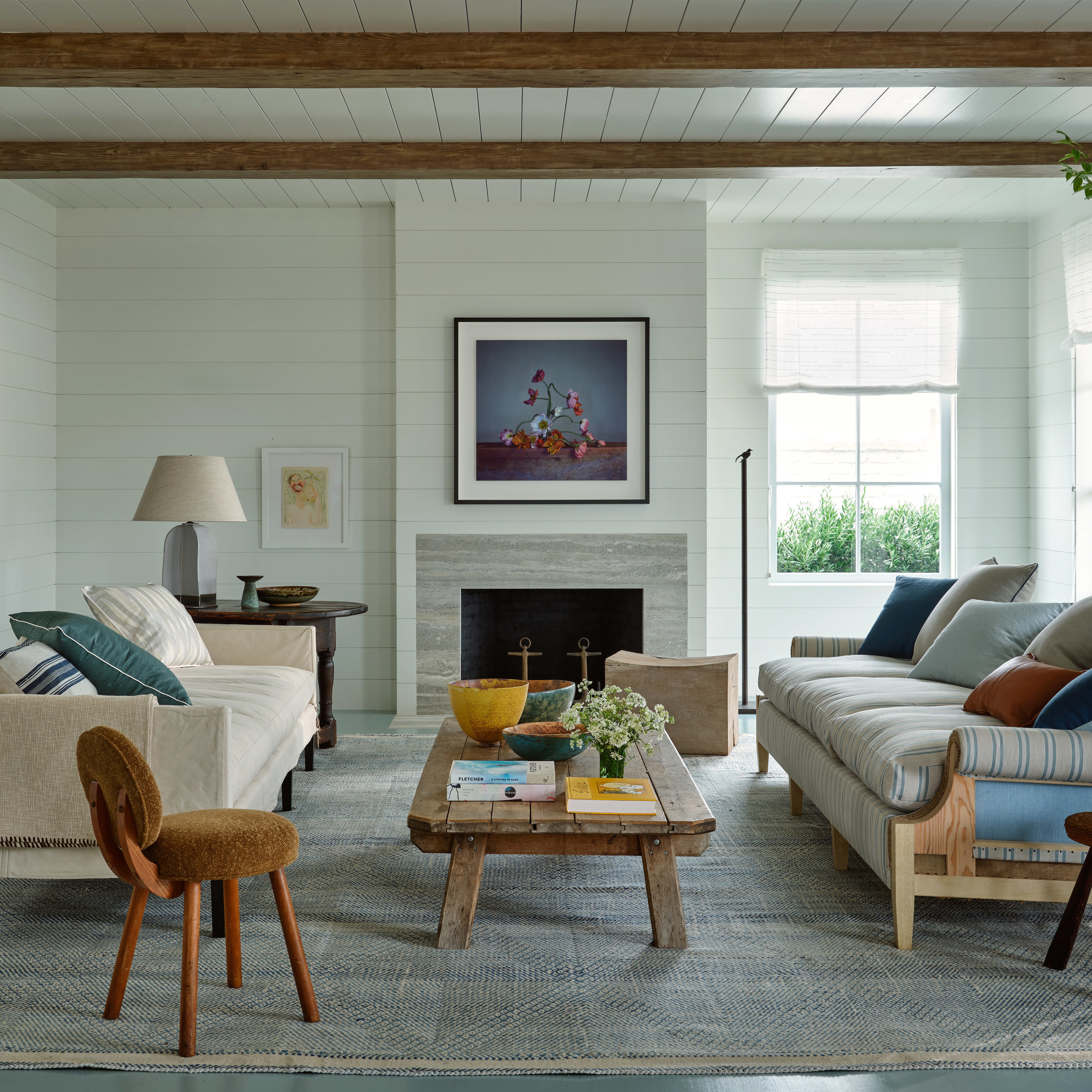 a living room filled with furniture and a fire place