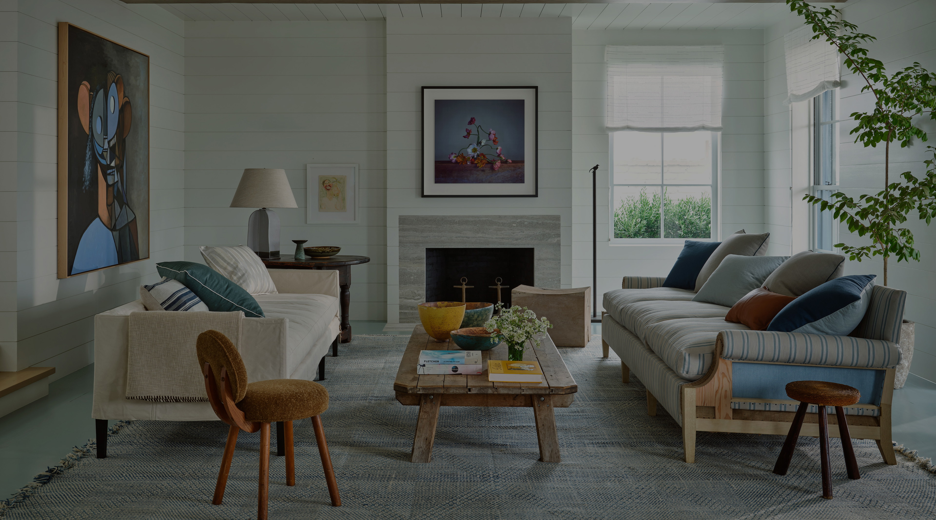 a living room filled with furniture and a fire place