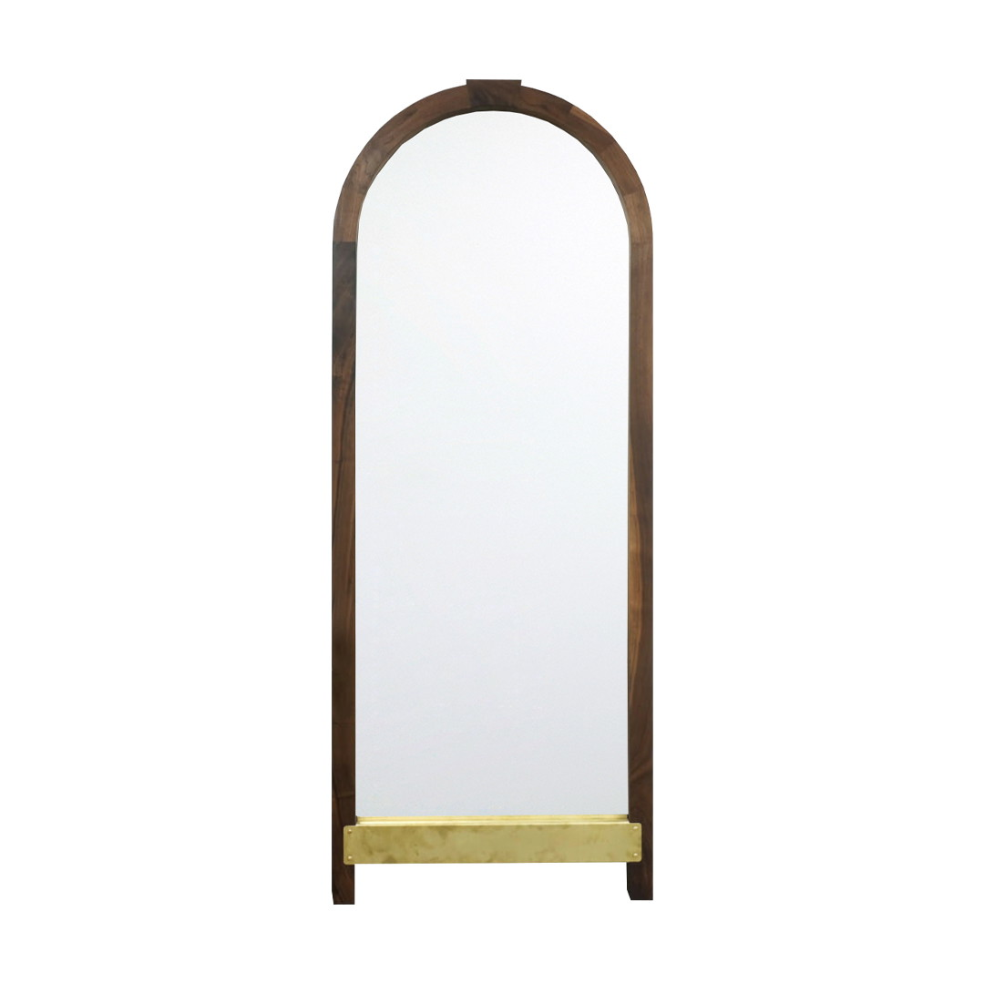 a tall mirror with a wooden frame and a yellow shelf