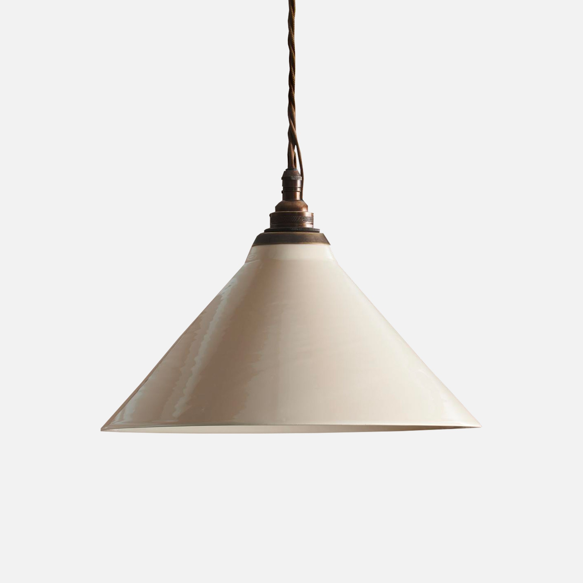 a white light hanging from a ceiling fixture