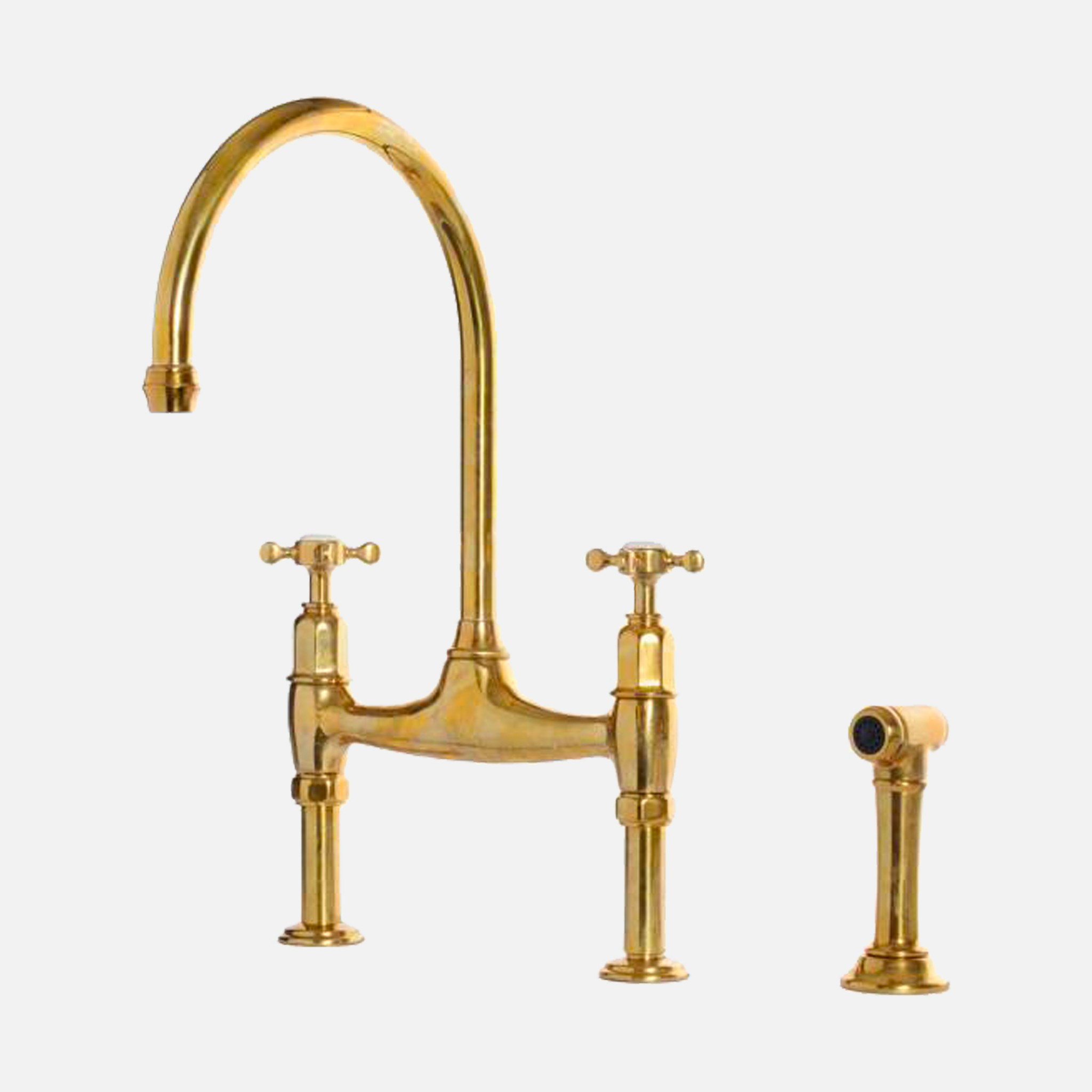 a gold faucet with two handles and two handles