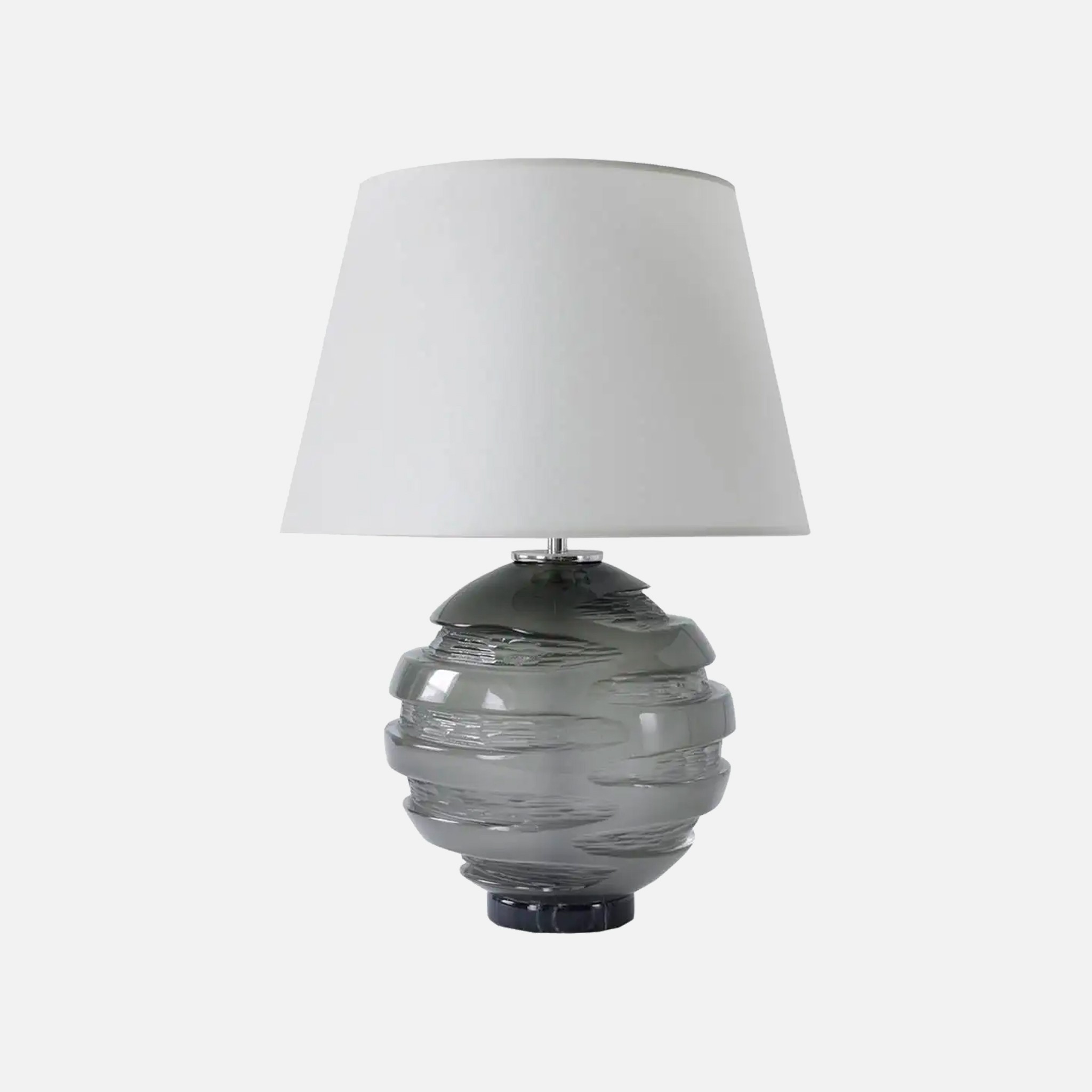 a gray lamp with a white shade on it