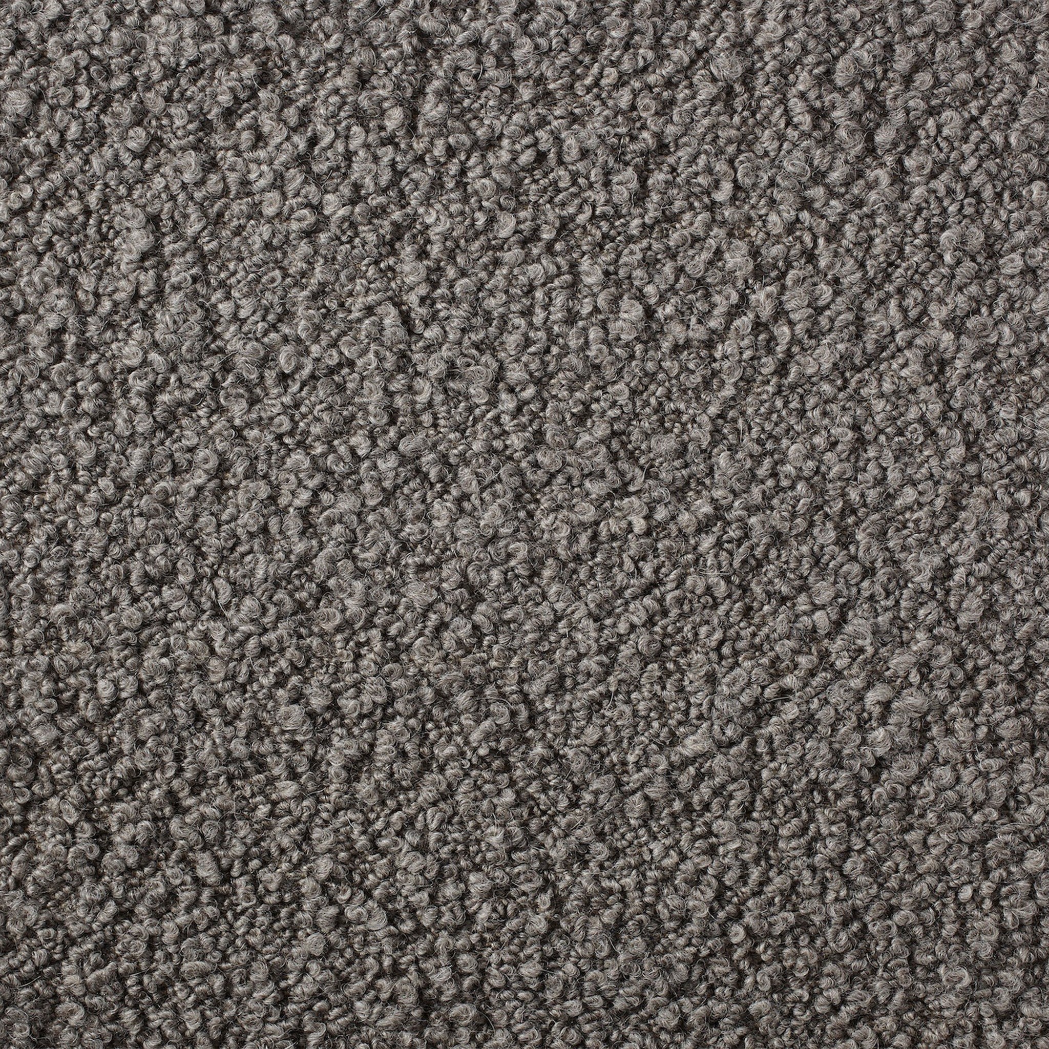 a close up view of a gray carpet