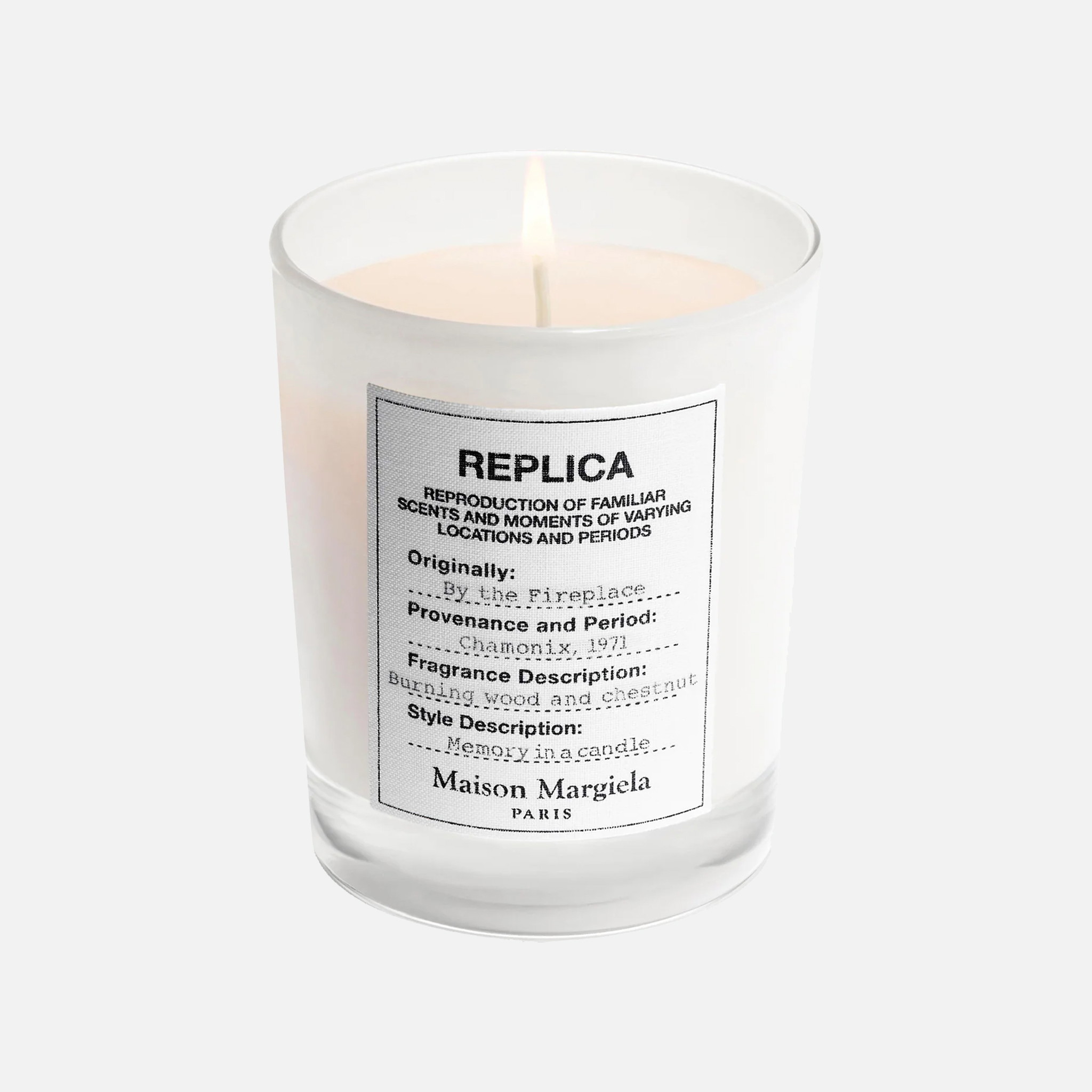a white candle with a label on it