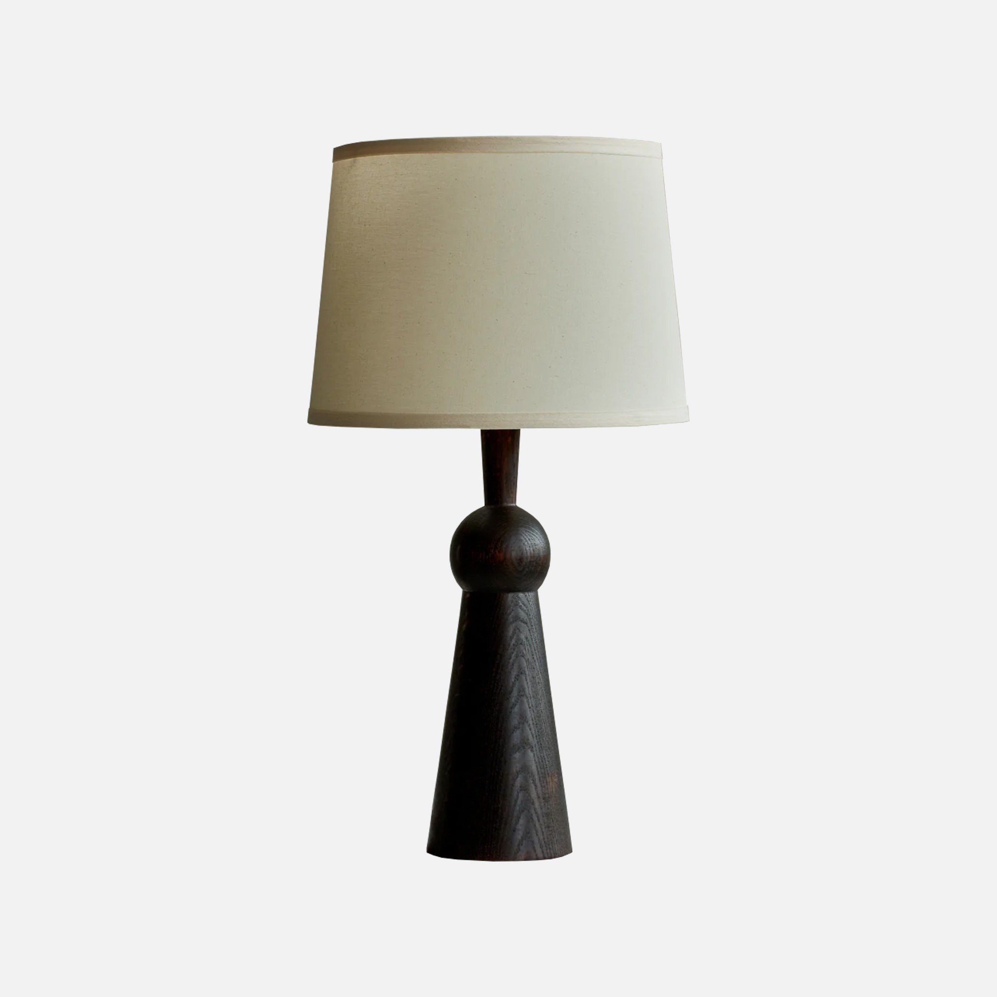 a table lamp with a white shade on it