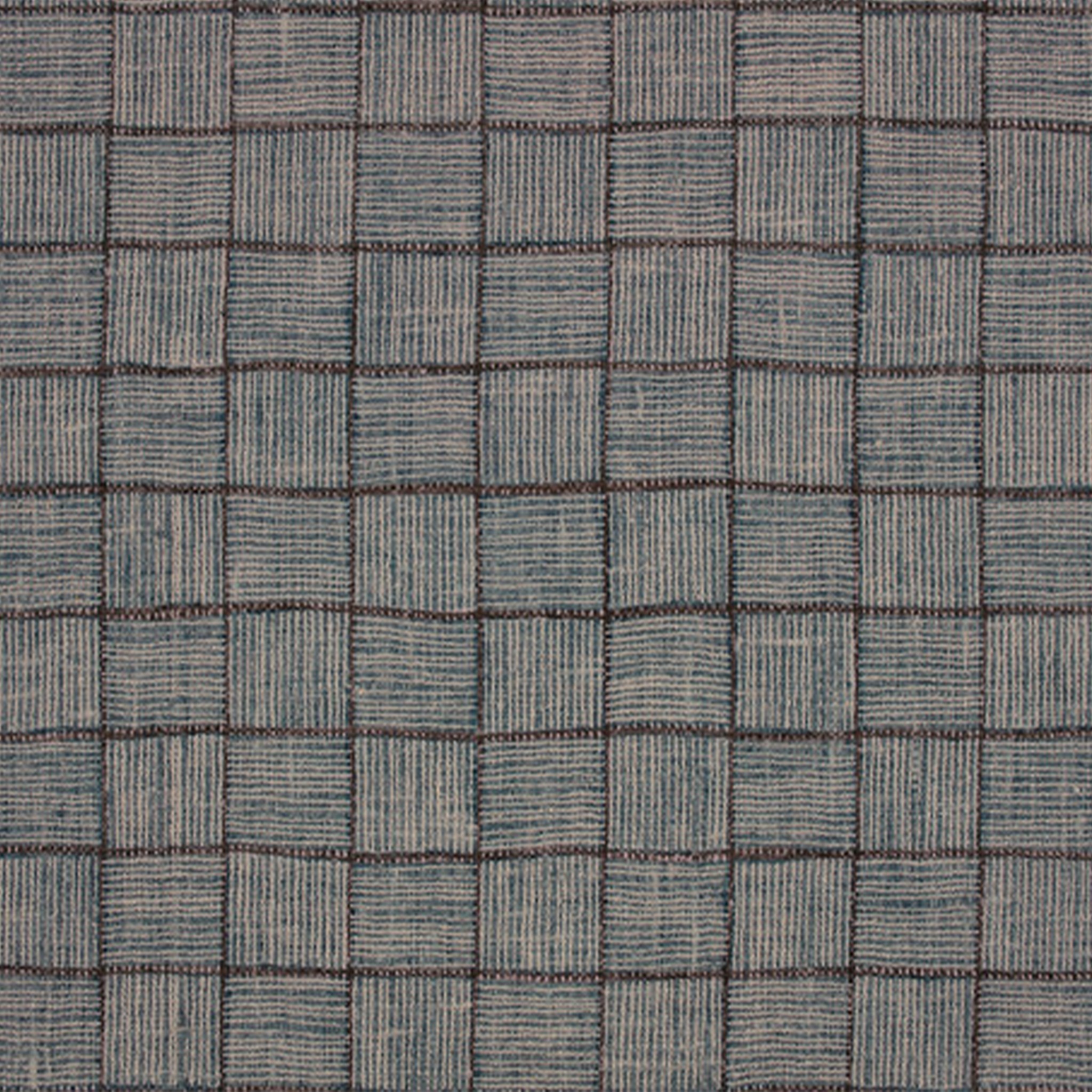 a close up of a blue and brown checkered fabric