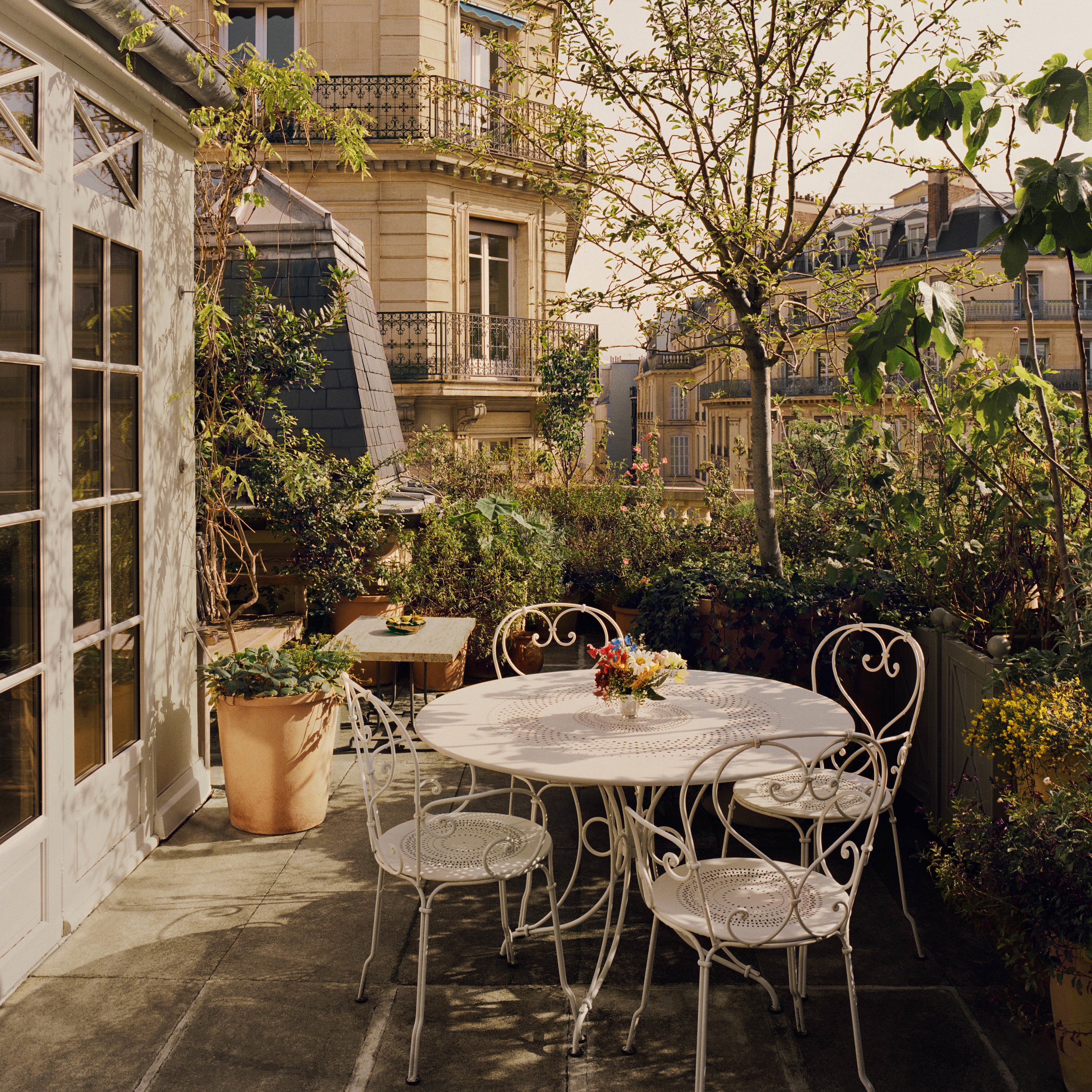 a white table and chairs on a patio