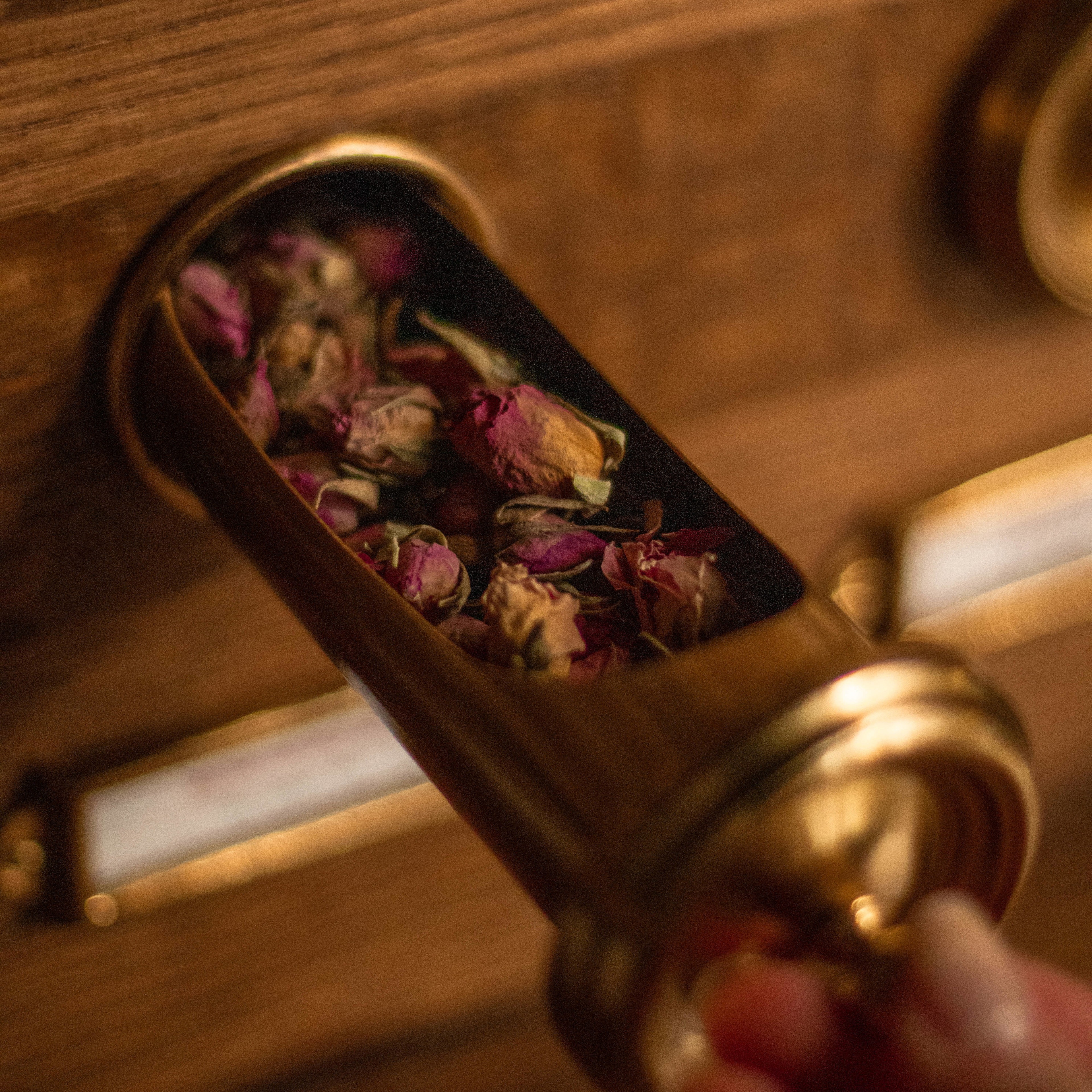 a close up of a person opening a wooden door