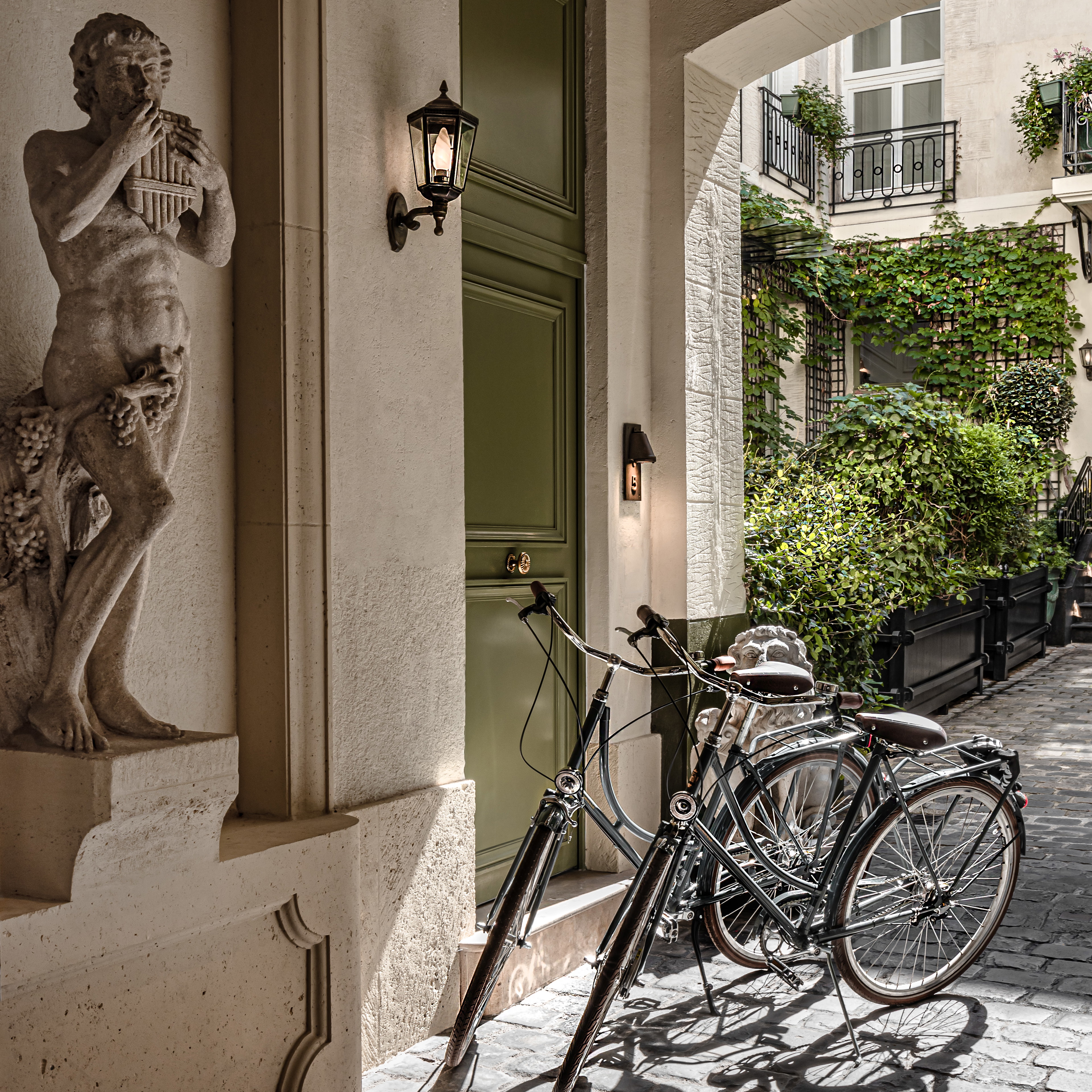 a couple of bikes parked next to a building