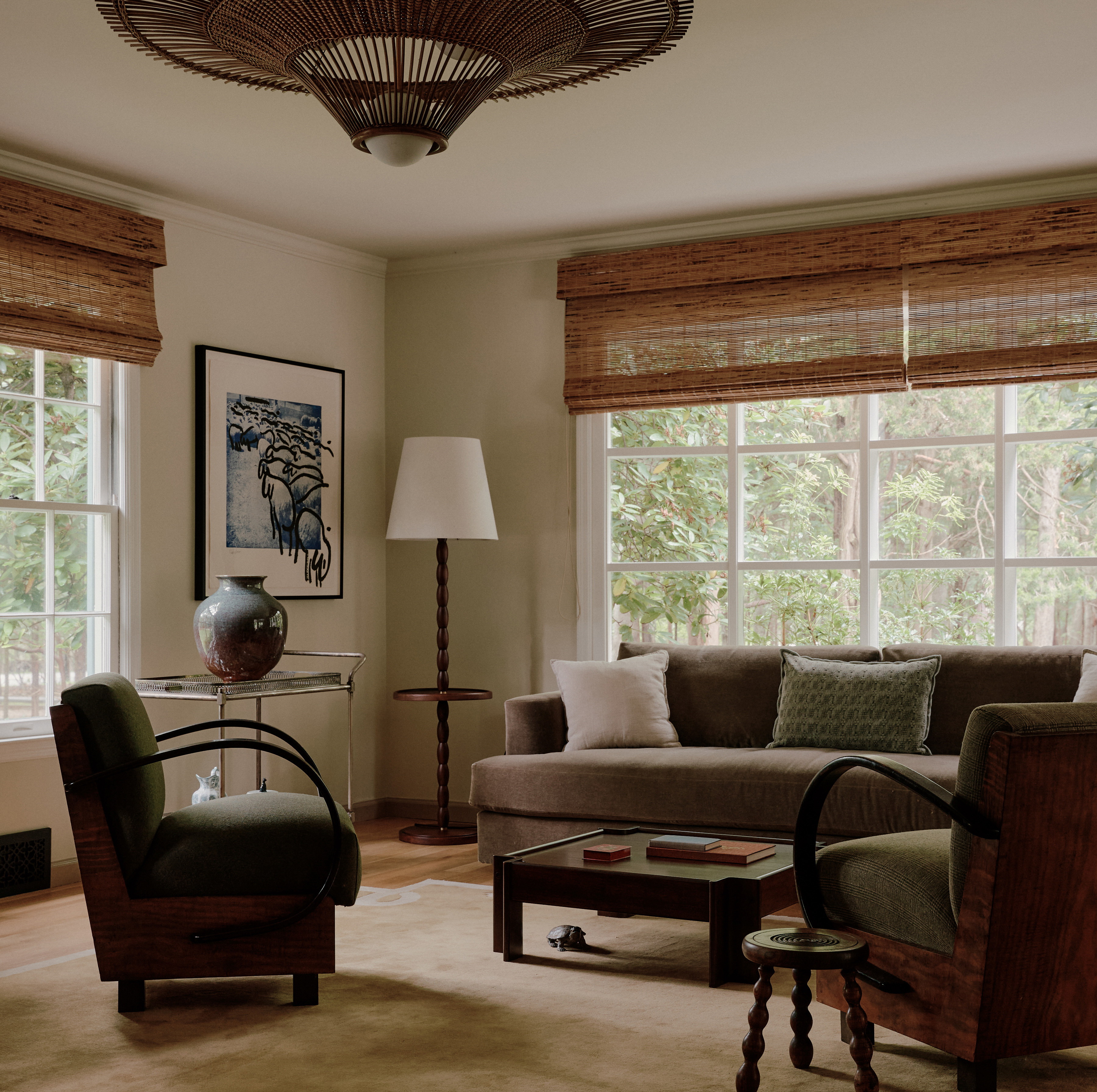 a living room filled with furniture and a lamp