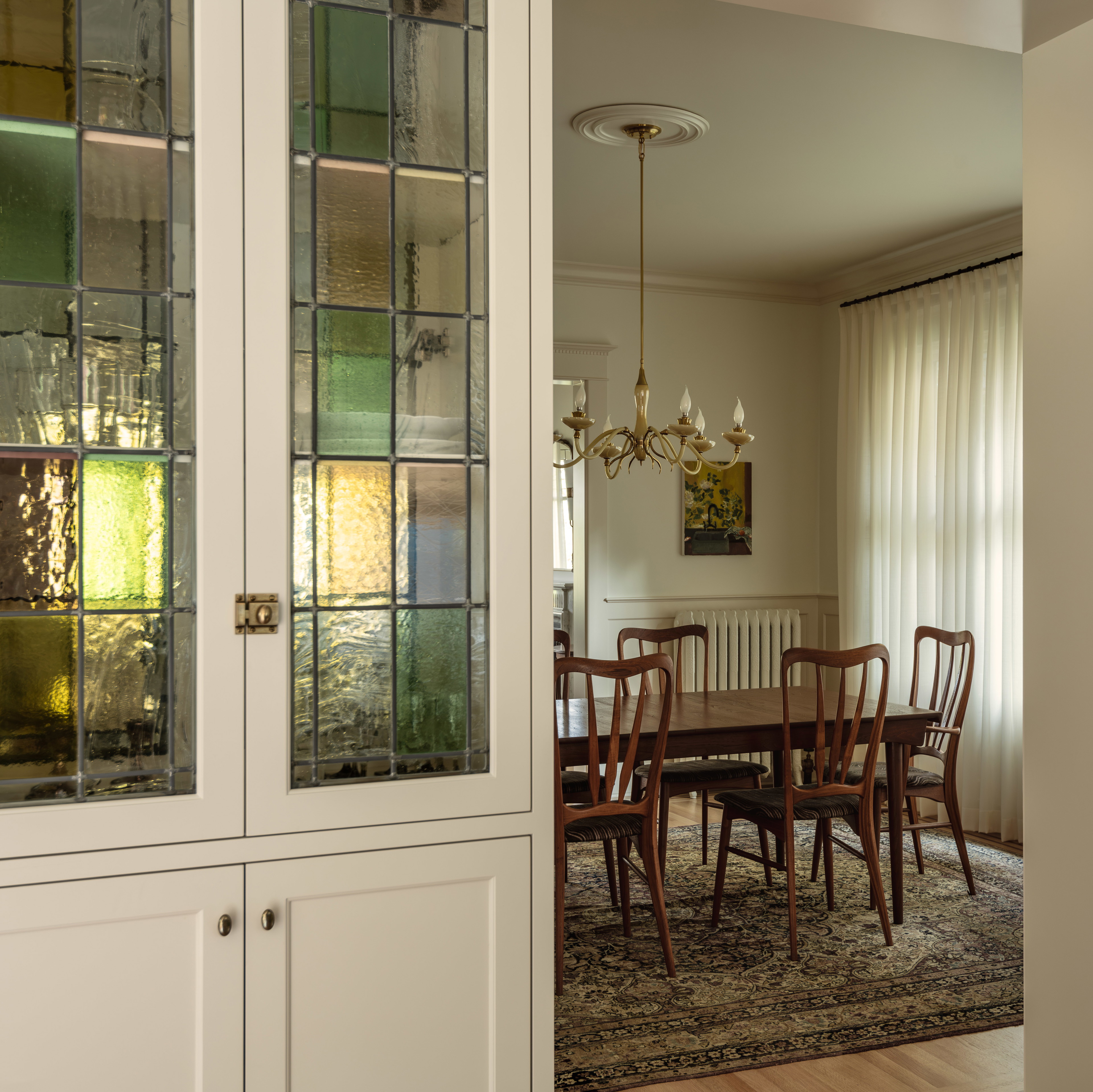 a dining room with a table and chairs in it