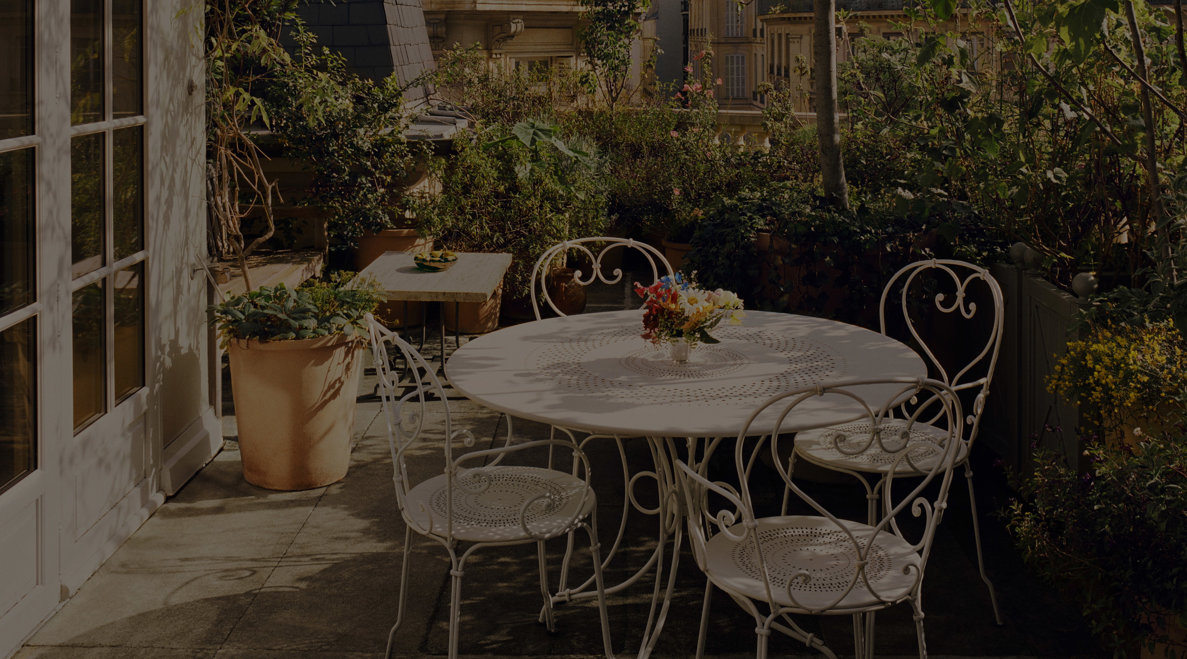 a white table and chairs on a patio