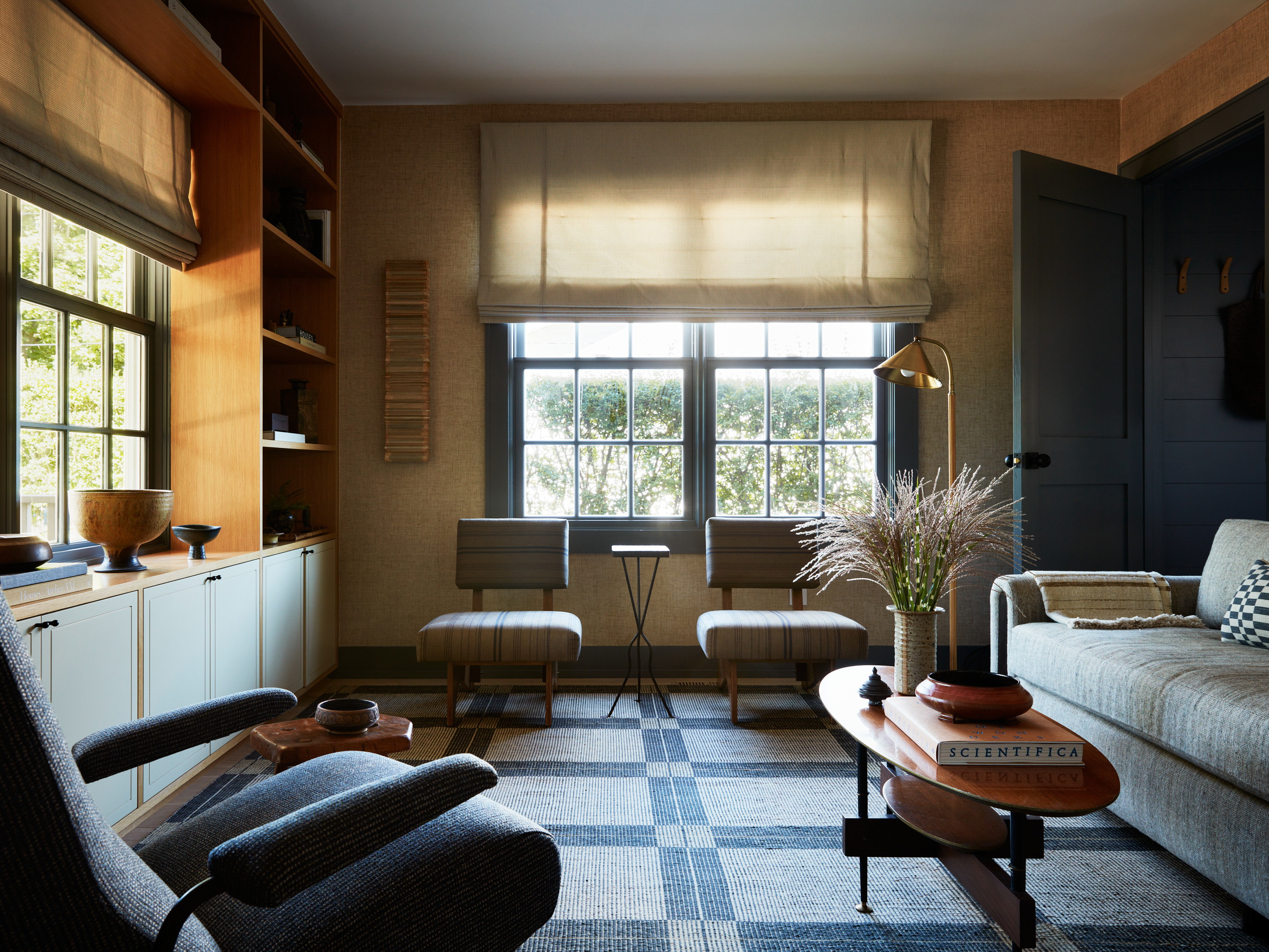 a living room filled with furniture and a window