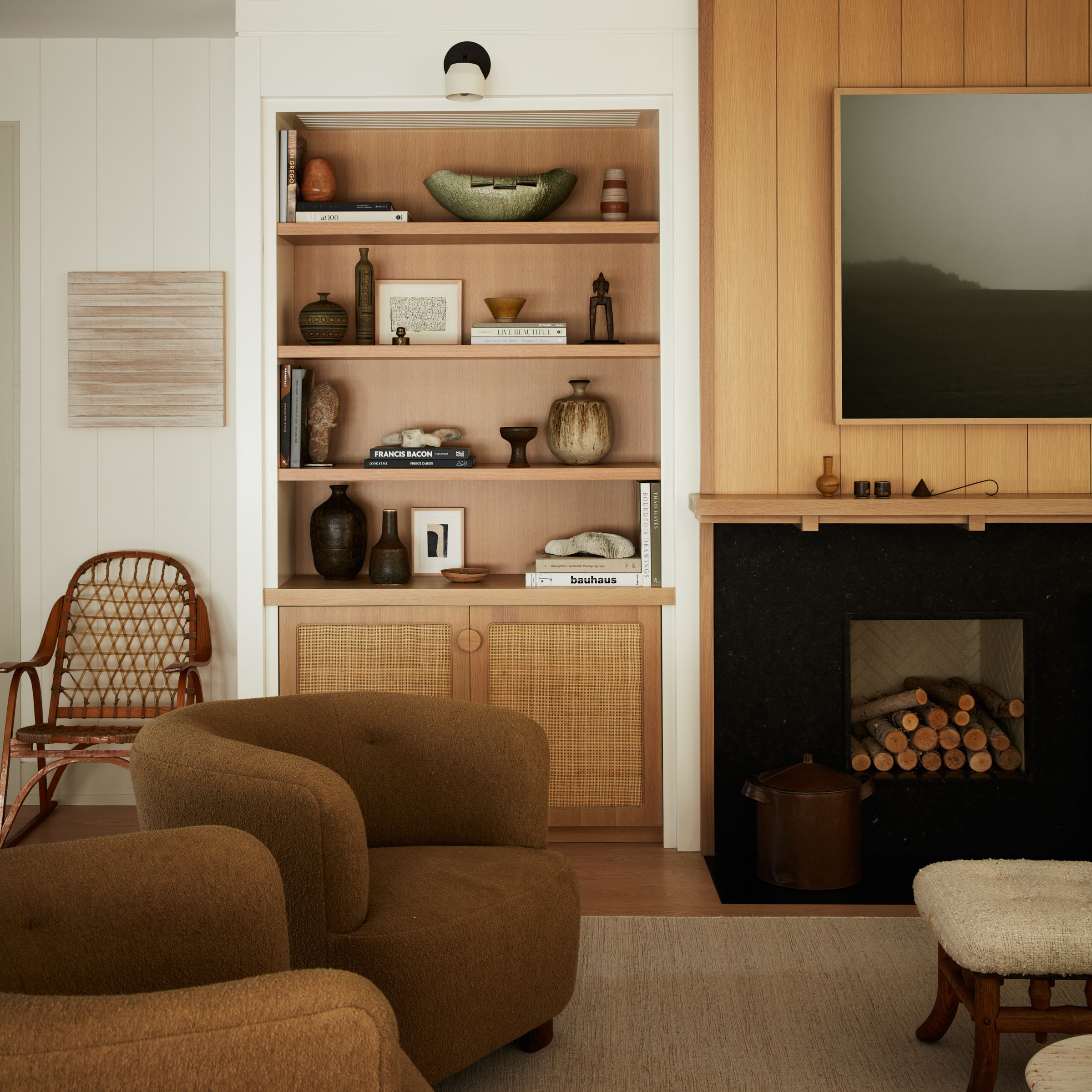a living room filled with furniture and a fire place