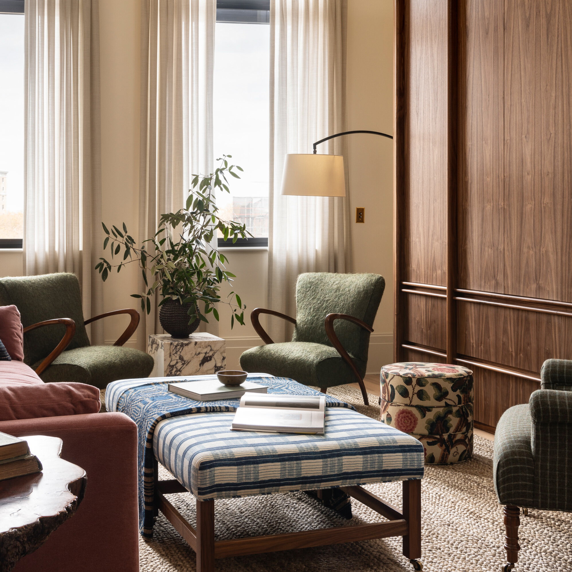 a living room filled with furniture and a large window