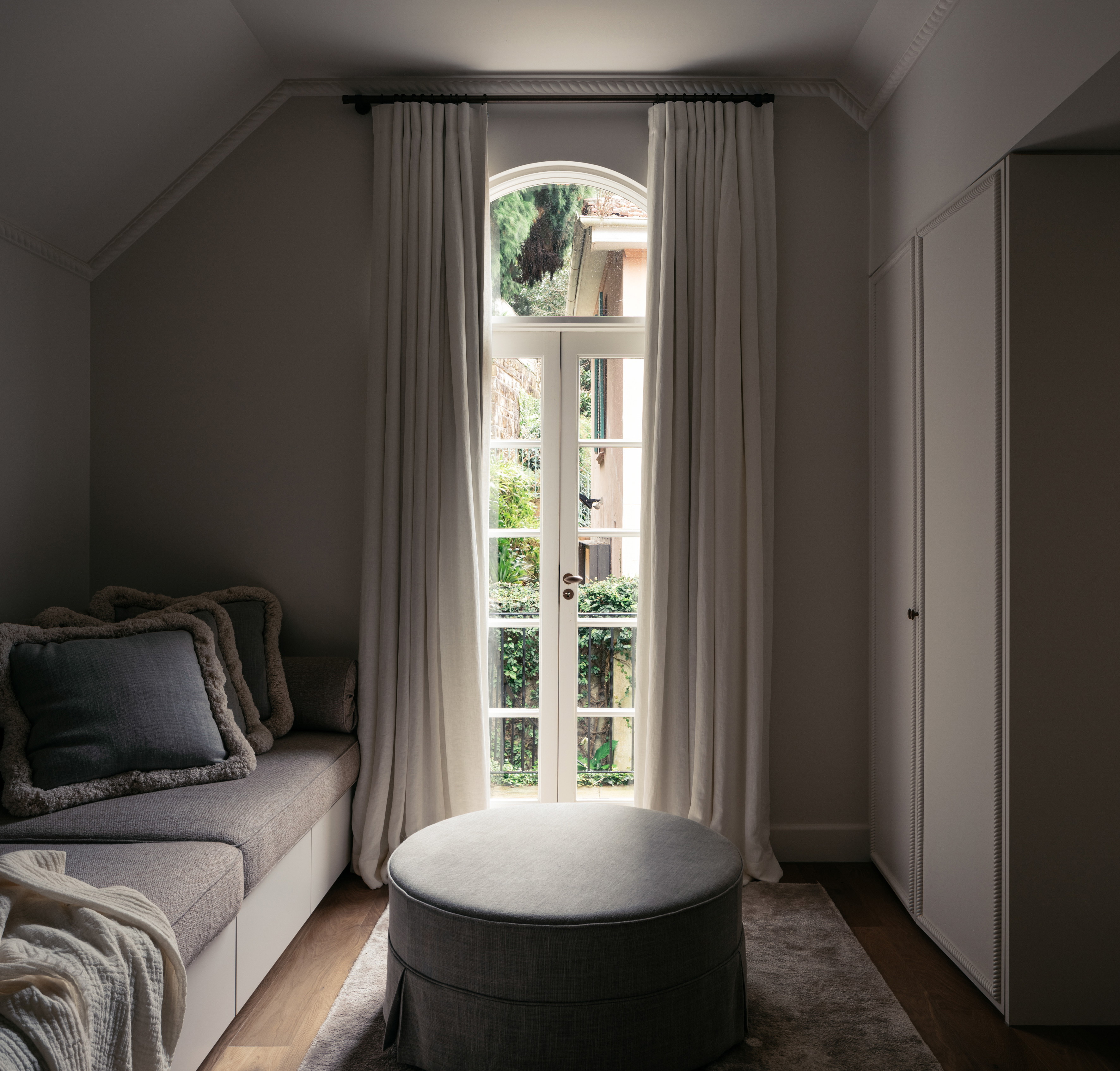 a living room with a couch and a large window