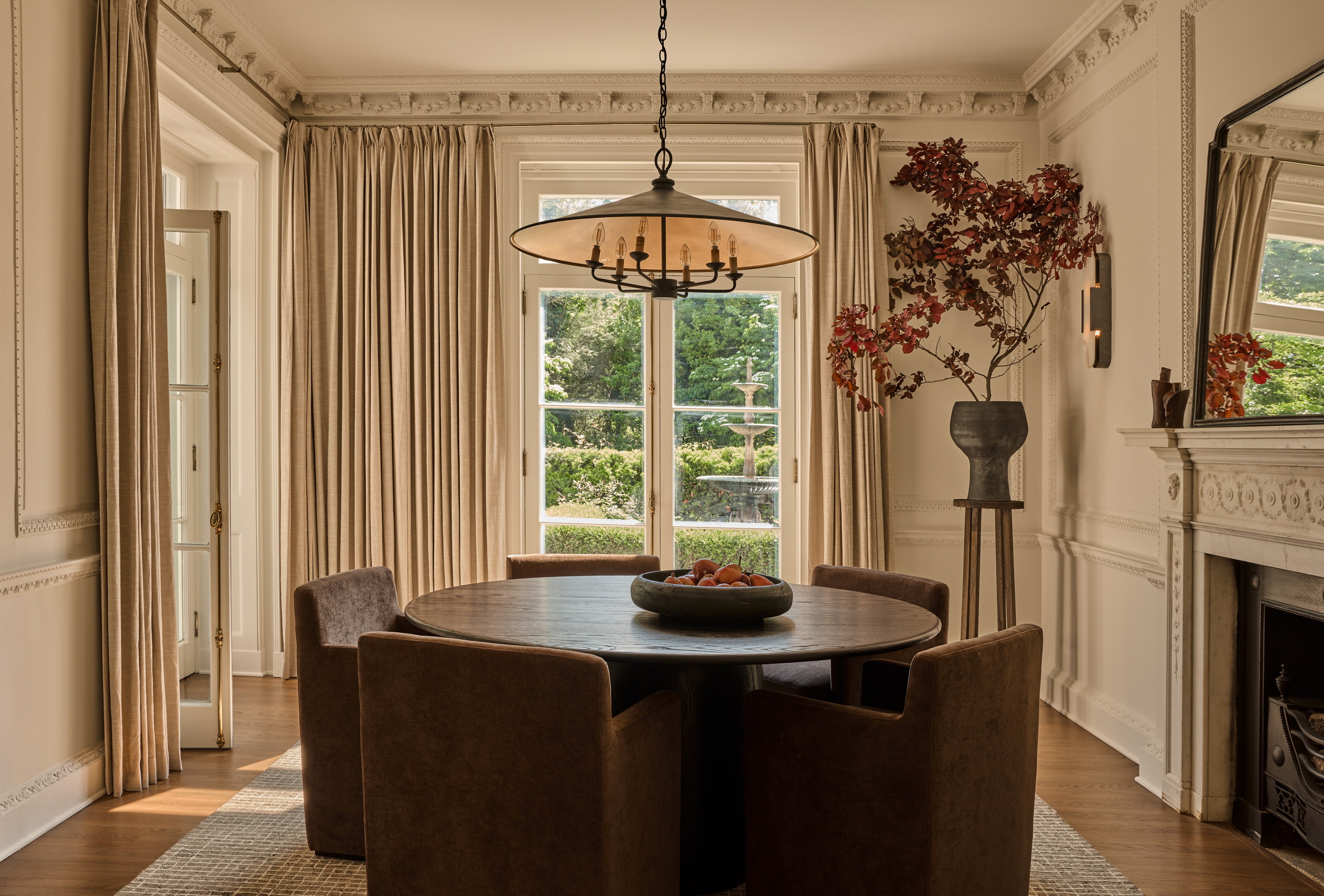 a dining room with a table and chairs