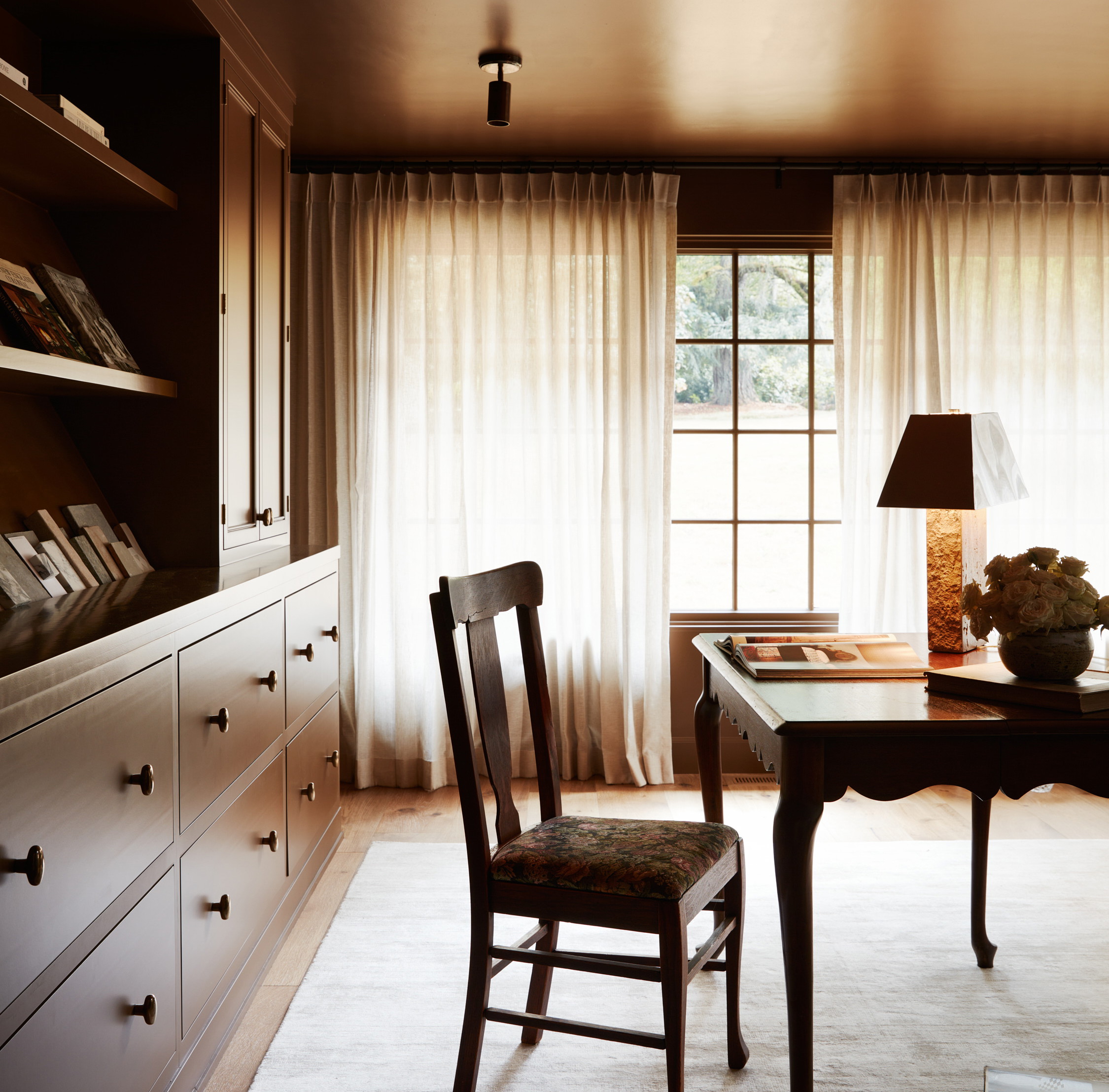 a room with a desk and a chair in it