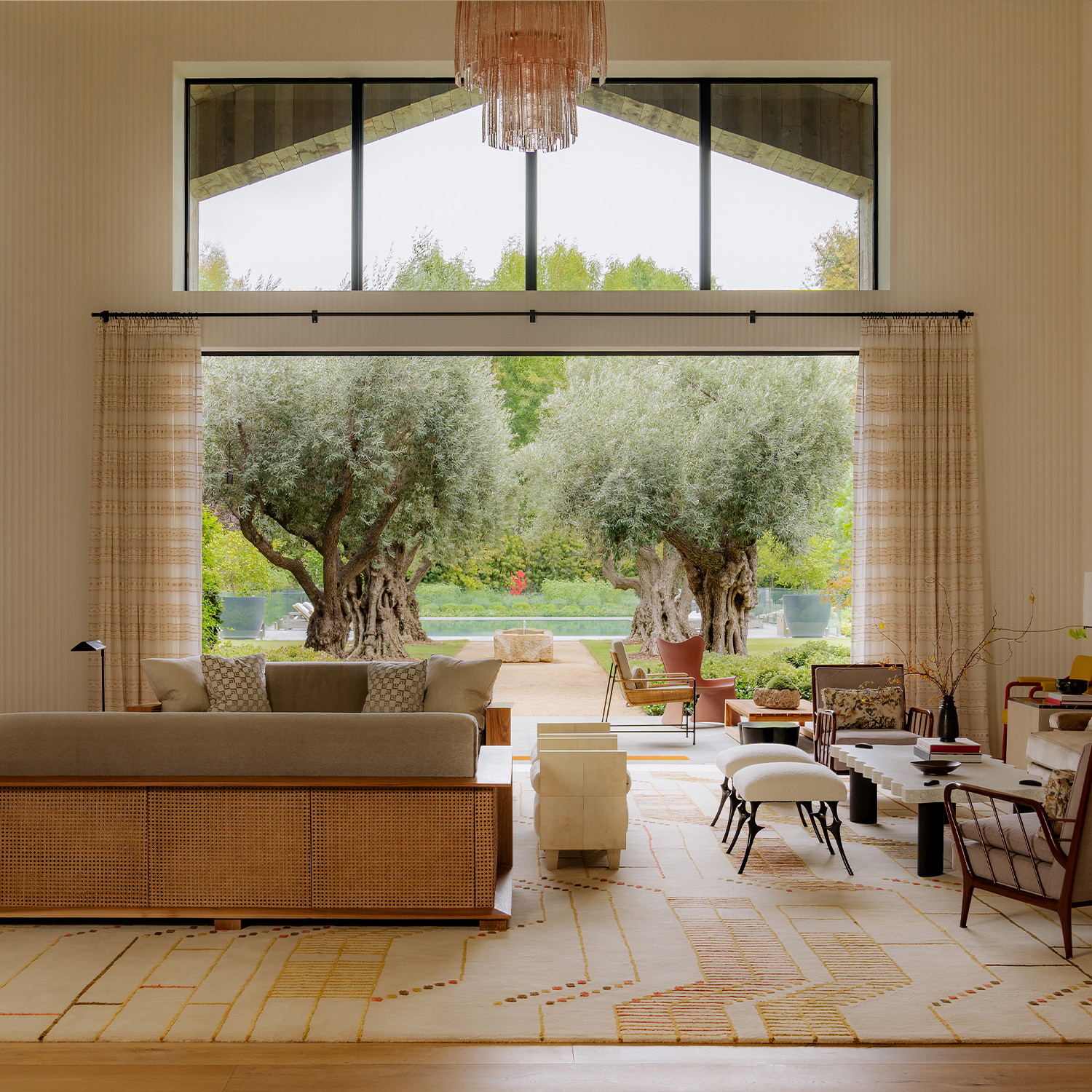 a living room filled with furniture and a large window