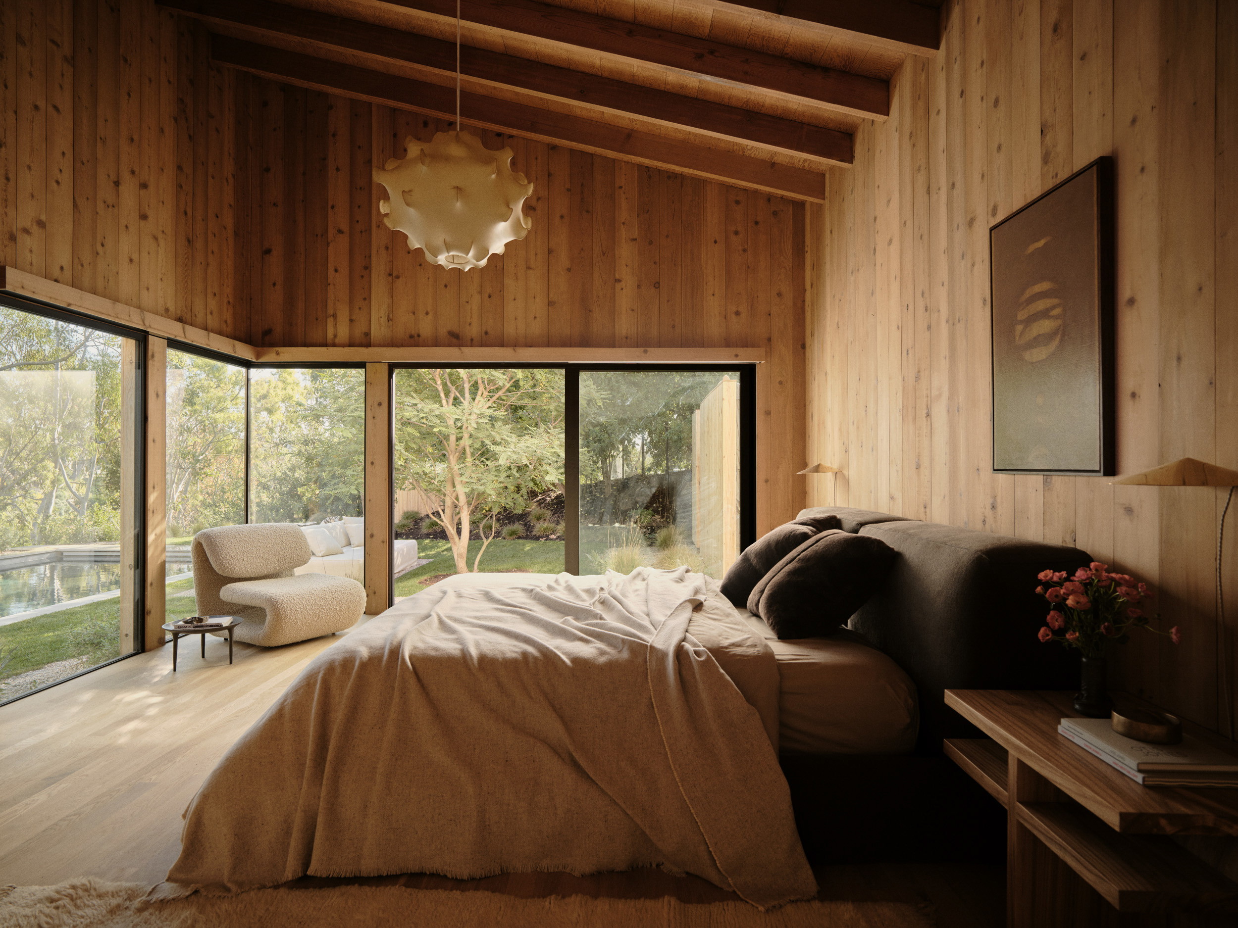 a bedroom with wooden walls and a large bed