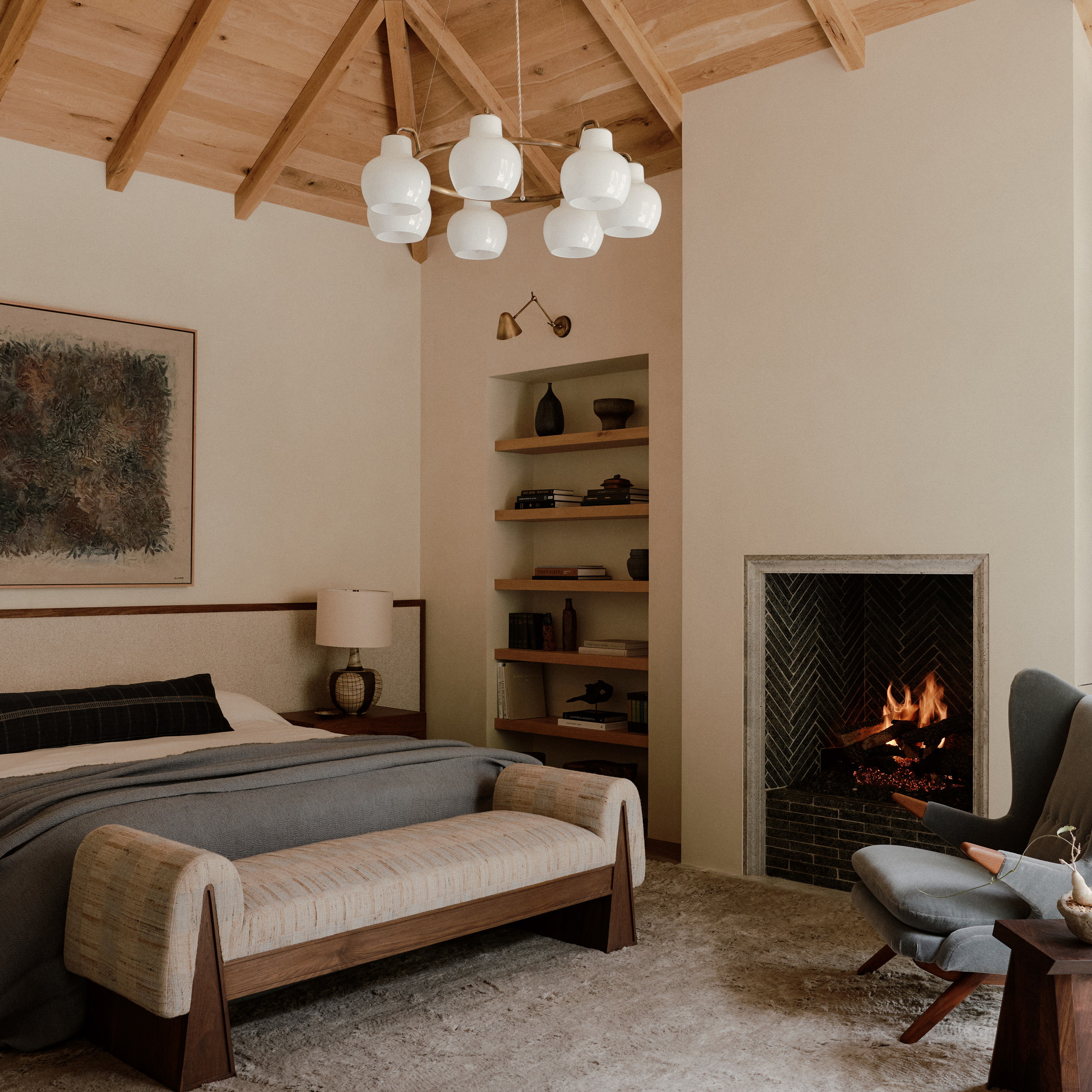a bedroom with a fireplace and a bed