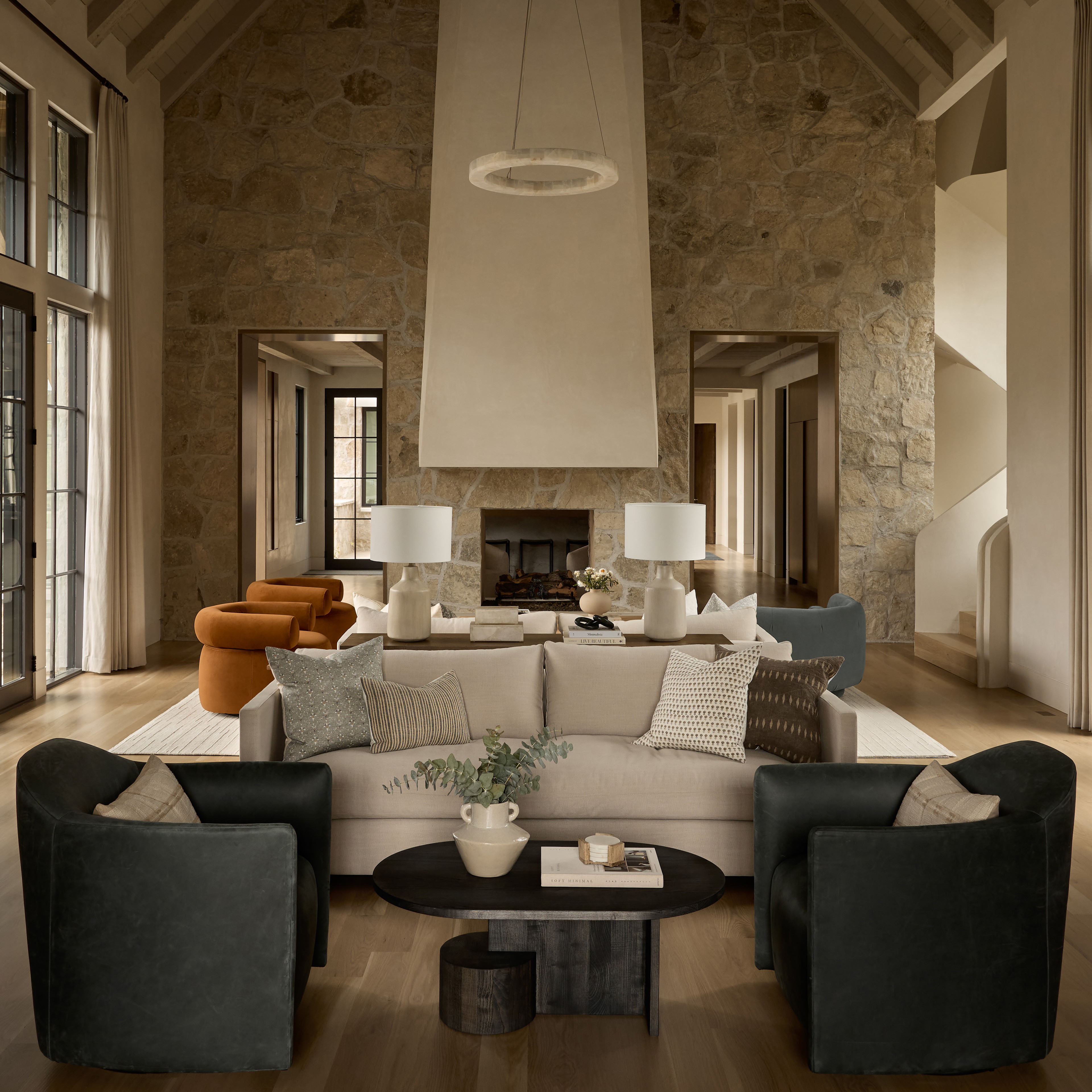 a living room filled with furniture and a fire place