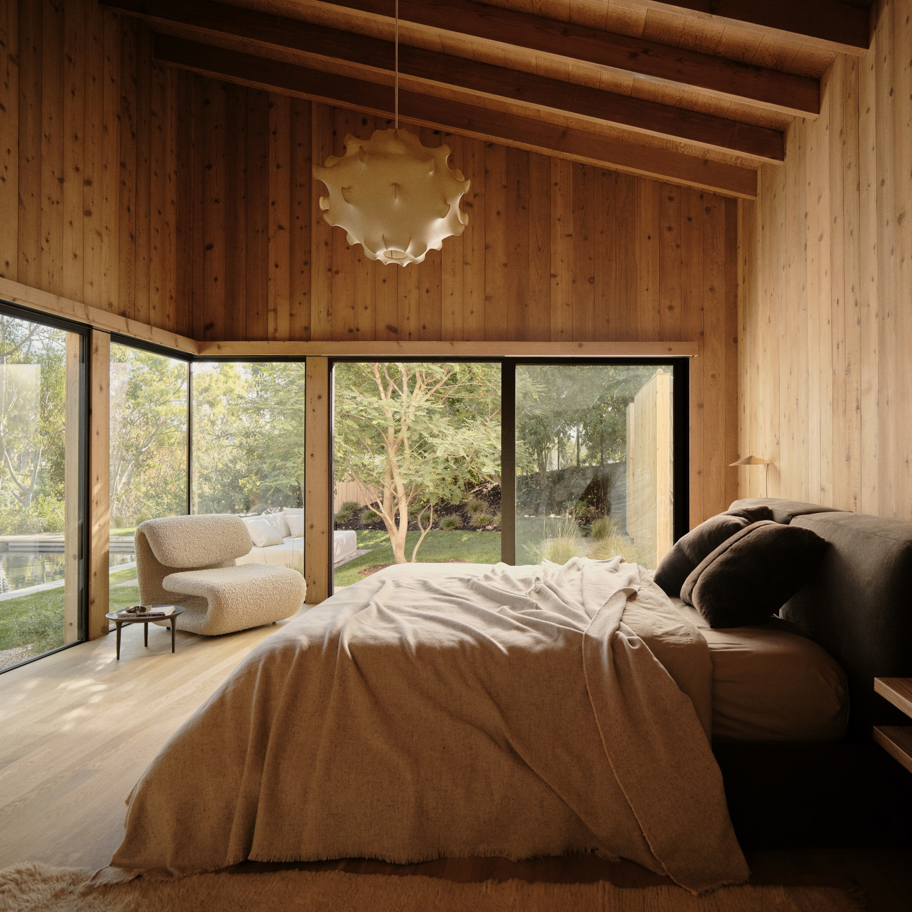 a bedroom with wooden walls and a large bed
