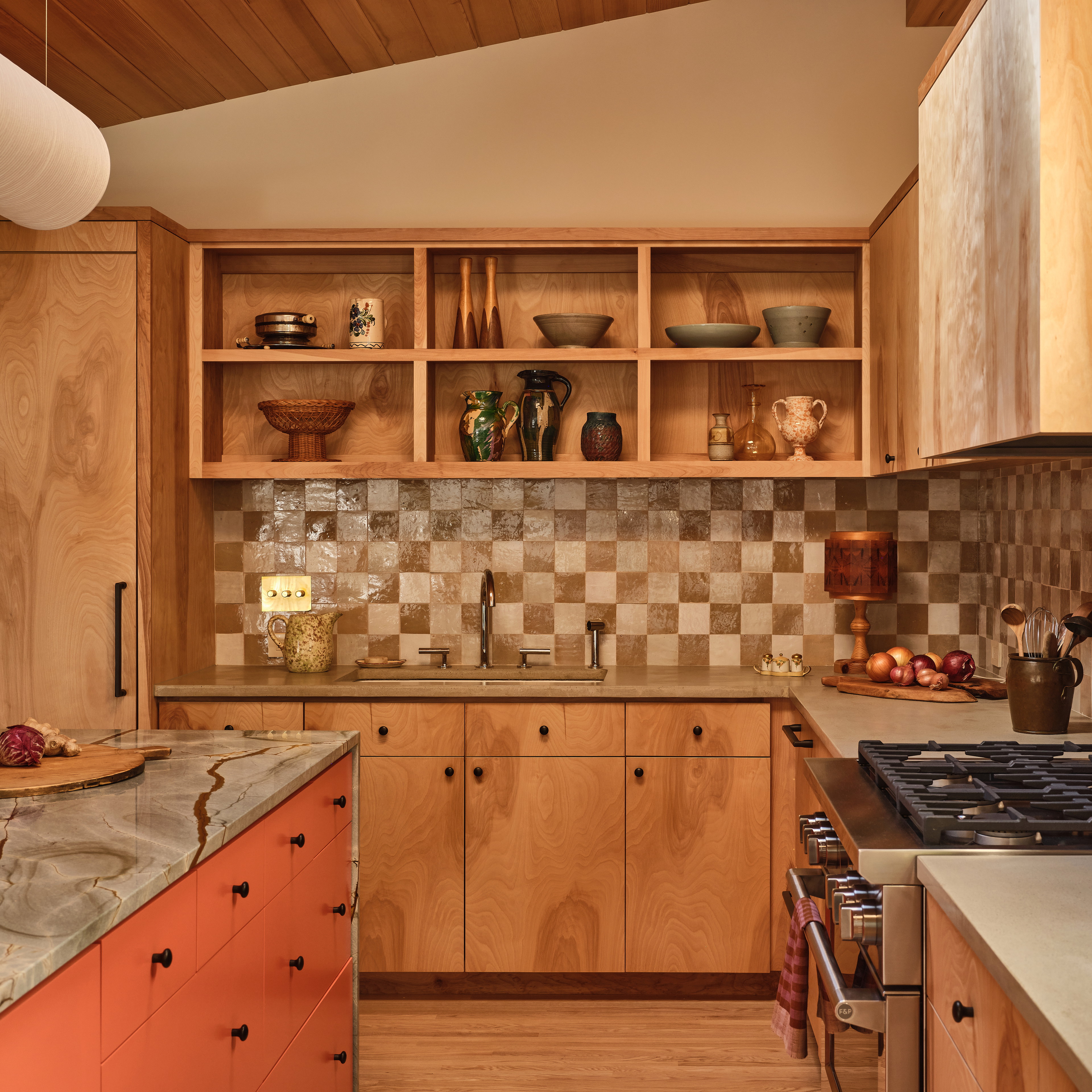 a kitchen with a stove top oven sitting next to a counter