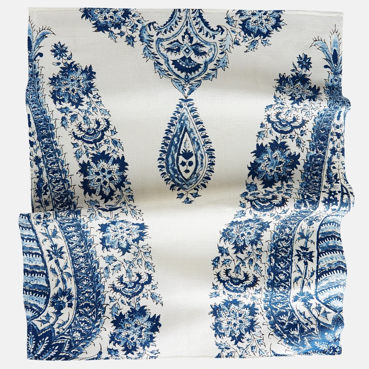 a blue and white paisley pattern on a white background