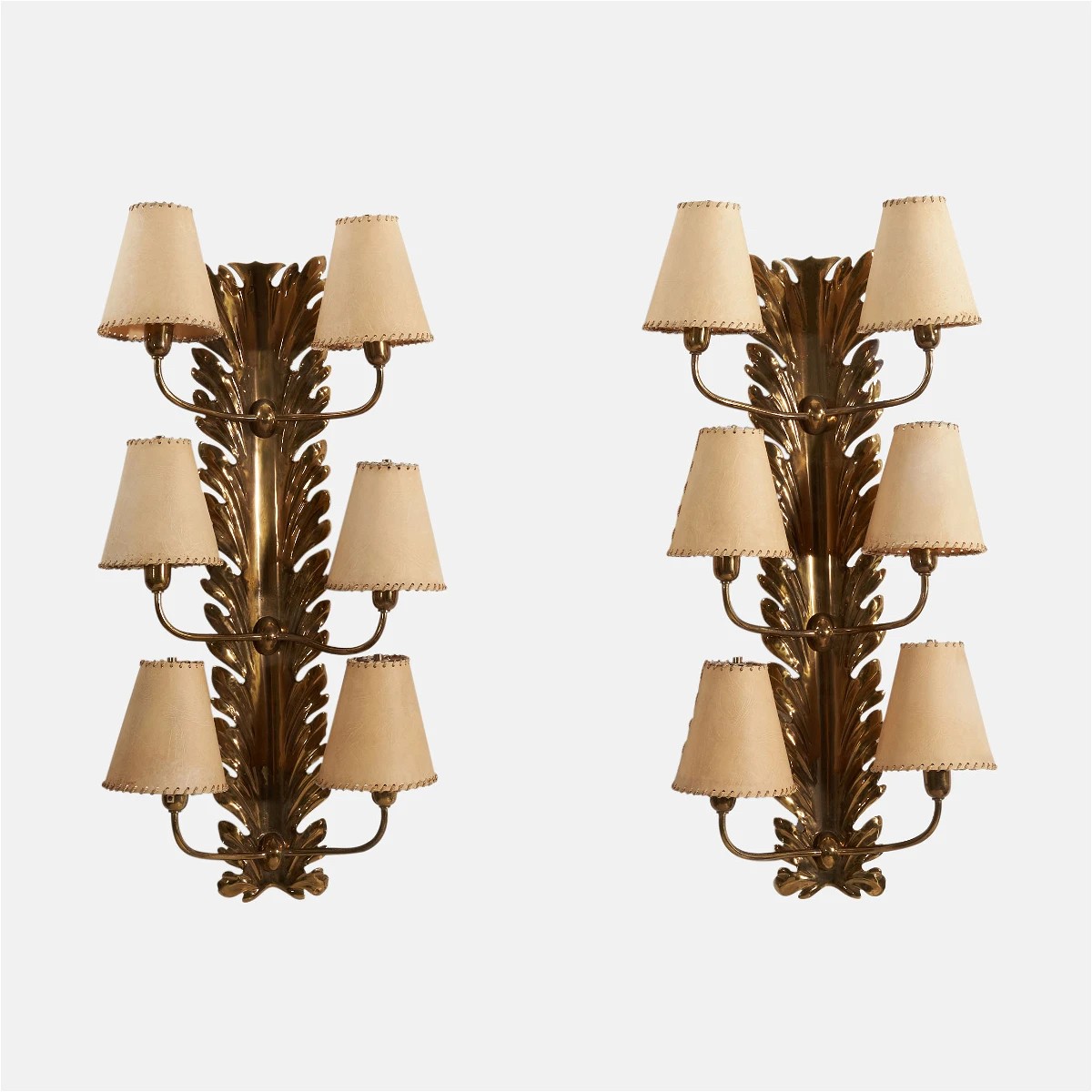 a pair of sconces with lamps on each of them