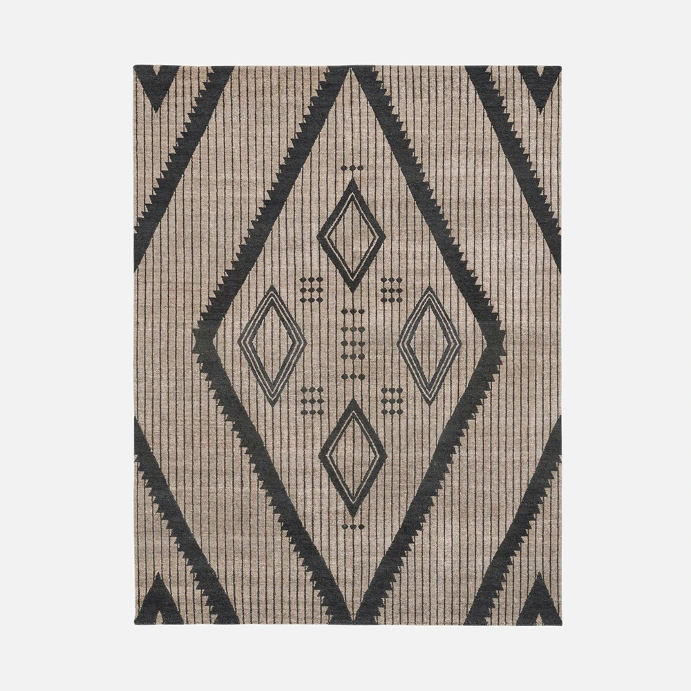 a beige and black rug with a diamond pattern