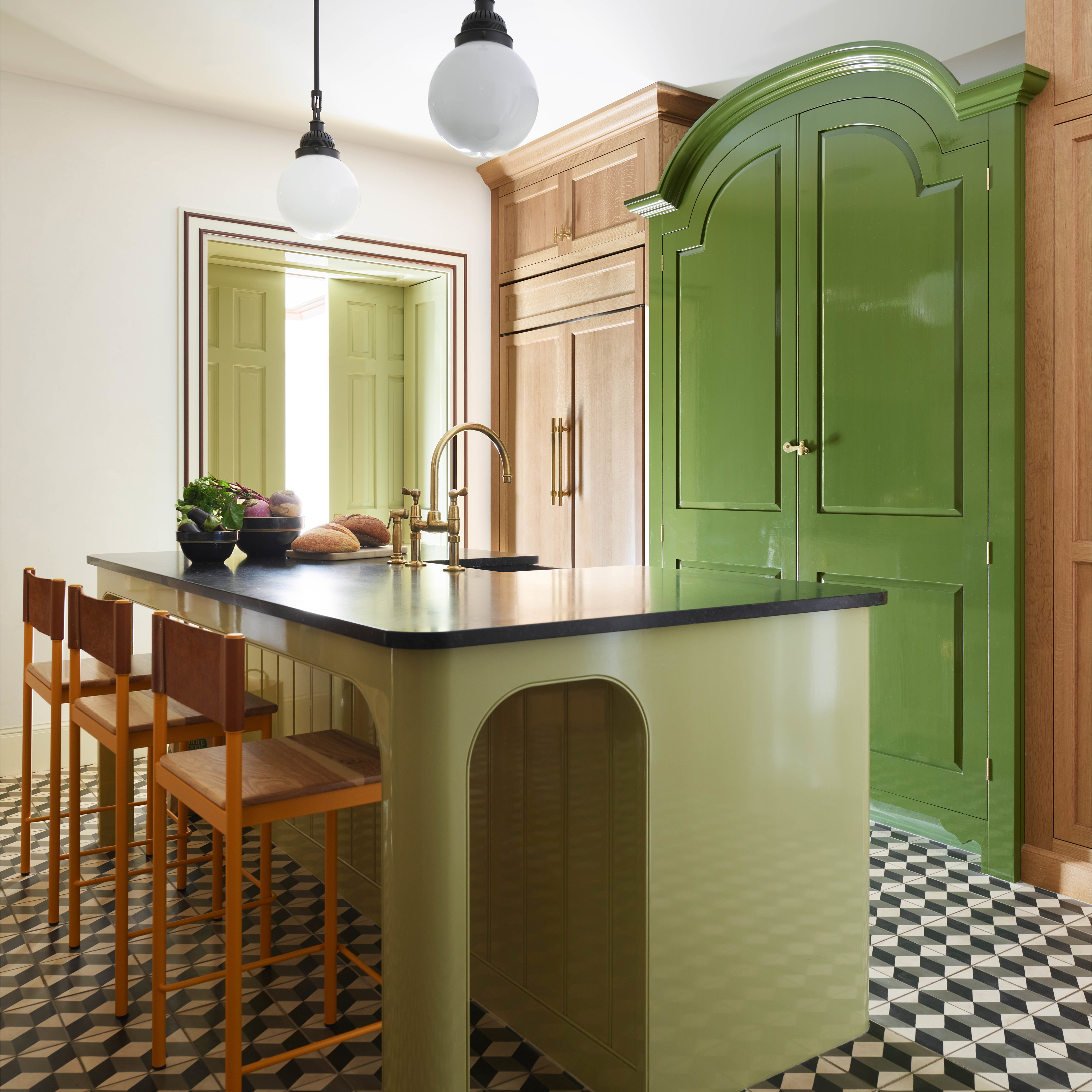 a kitchen with a checkered floor and green cabinets