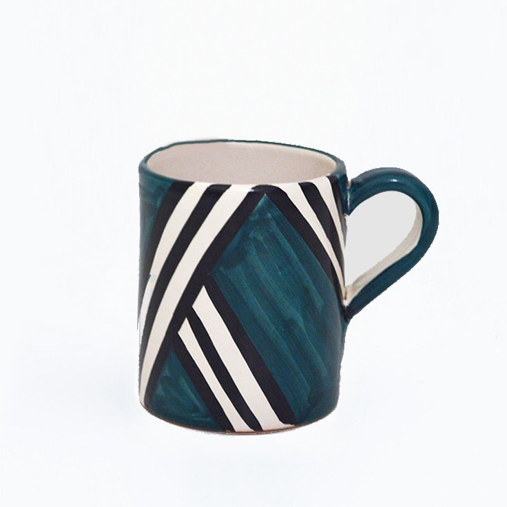 a blue and white striped coffee cup on a white background