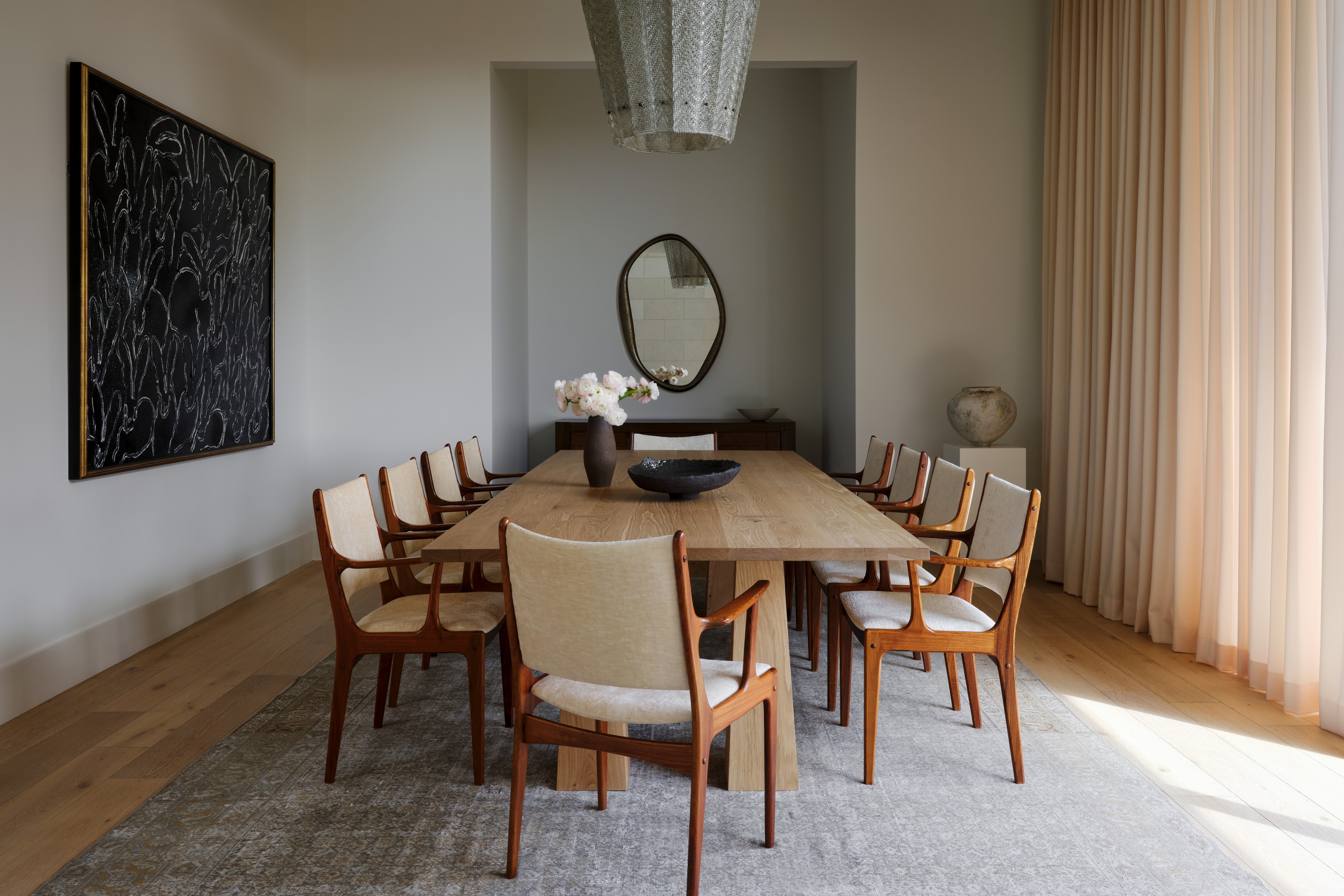 a dining room table with chairs around it