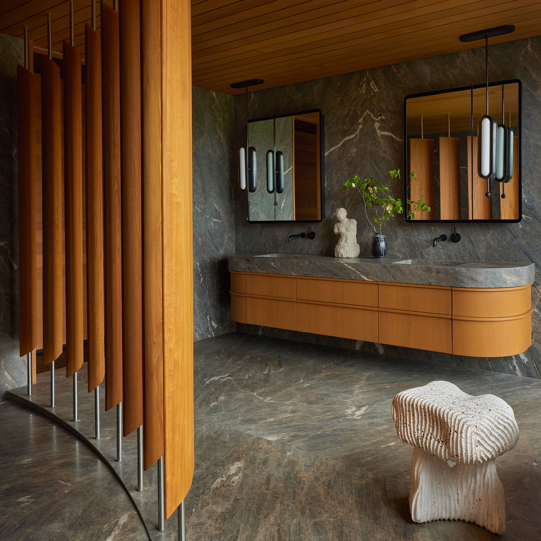 a bathroom with a marble counter top and two sinks