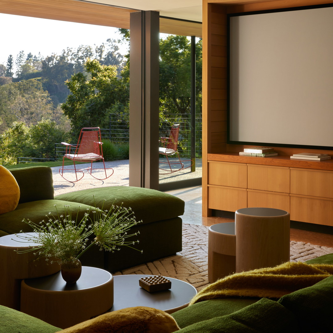 a living room filled with furniture and a flat screen tv