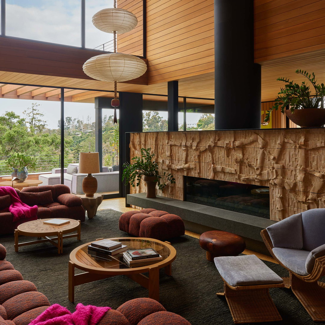 a living room filled with furniture and a fire place