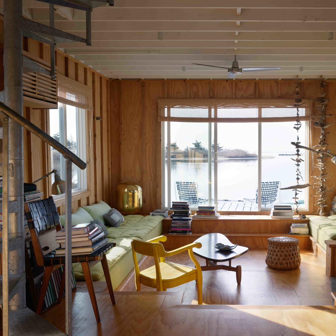 a living room filled with furniture and a fire place