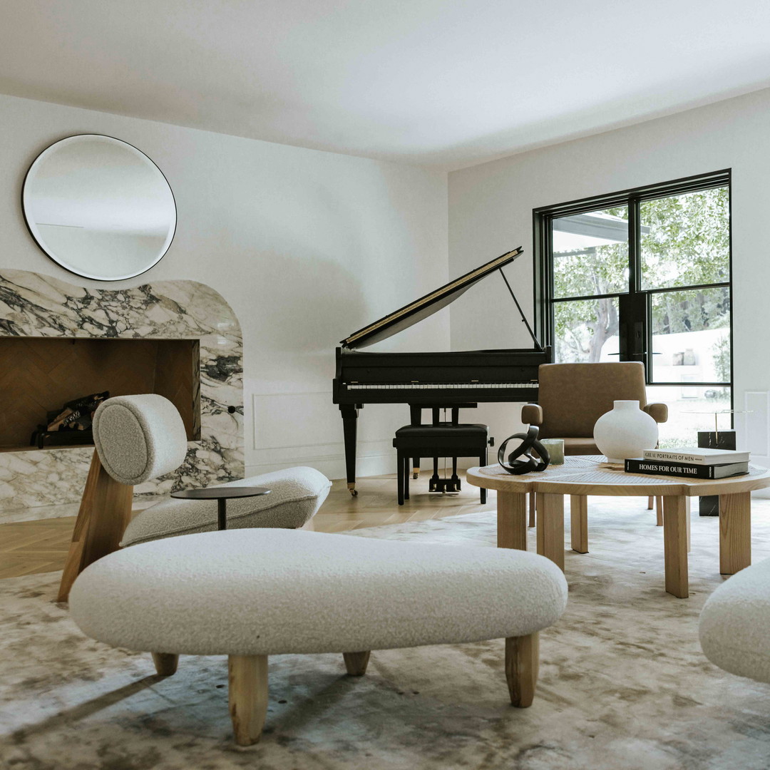 a living room filled with furniture and a piano