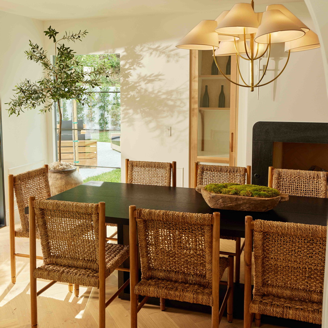 a dining room with a table and chairs