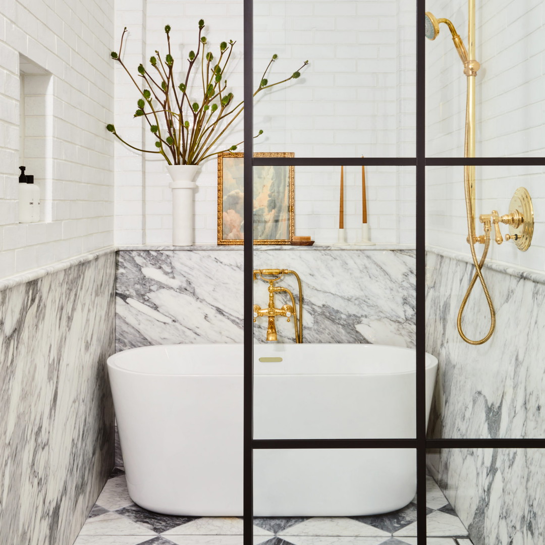 a bathroom with marble walls and flooring