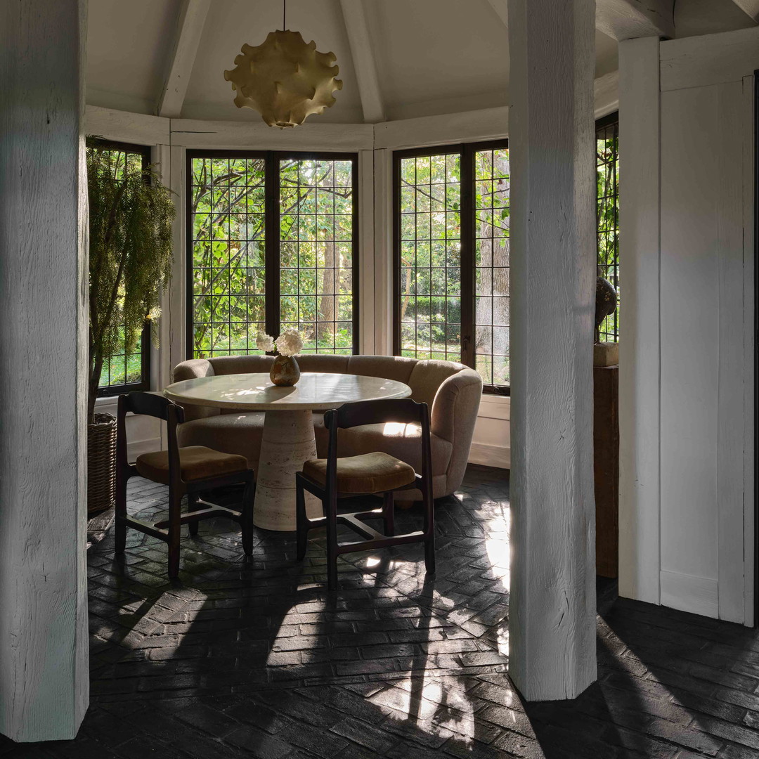 a dining room with a table and chairs