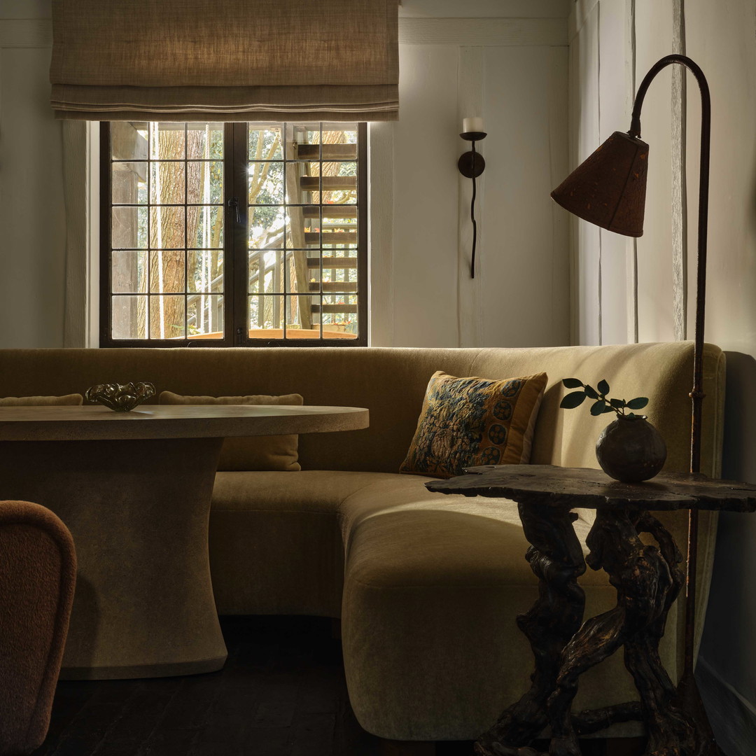 a living room filled with furniture and a table