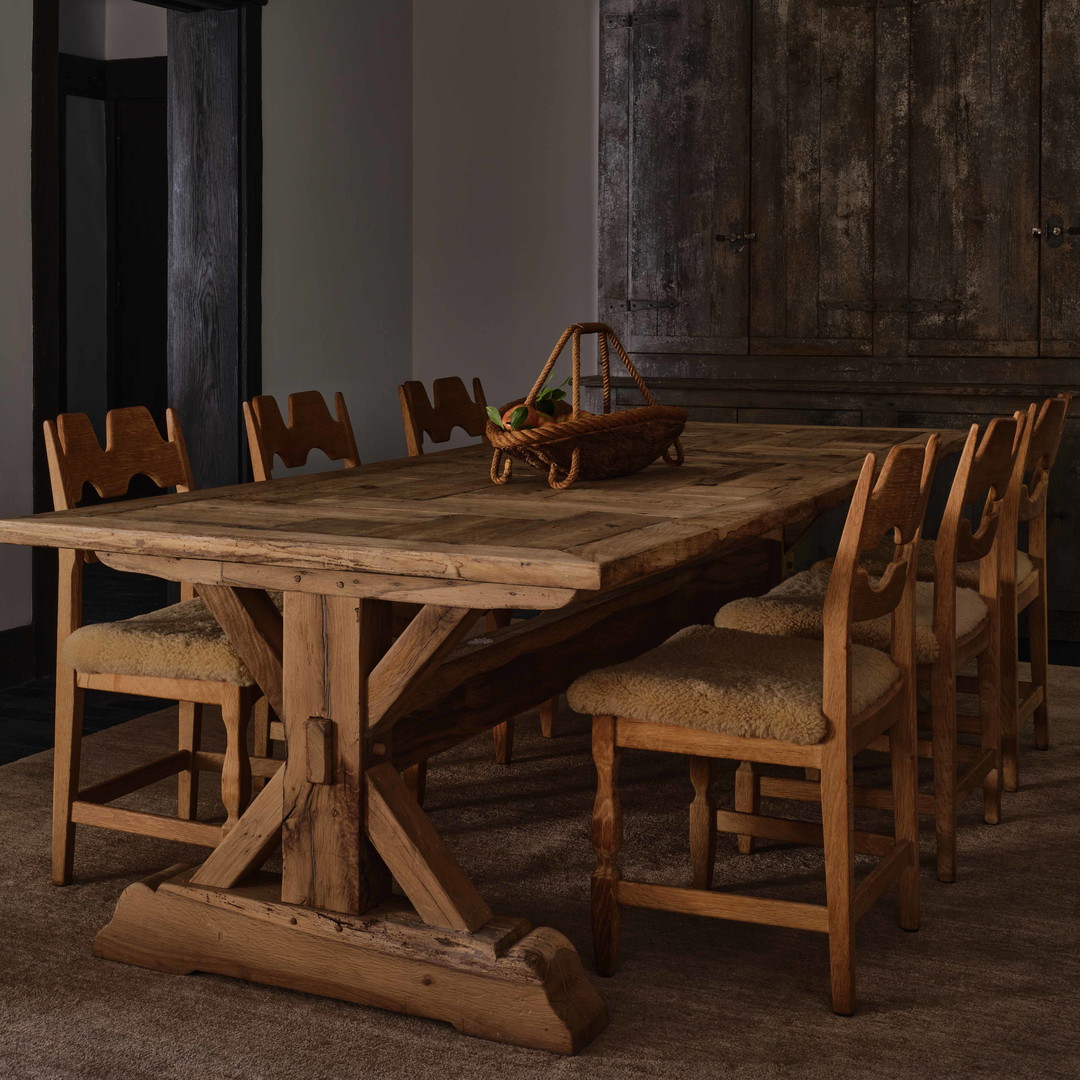 a large wooden table with chairs around it