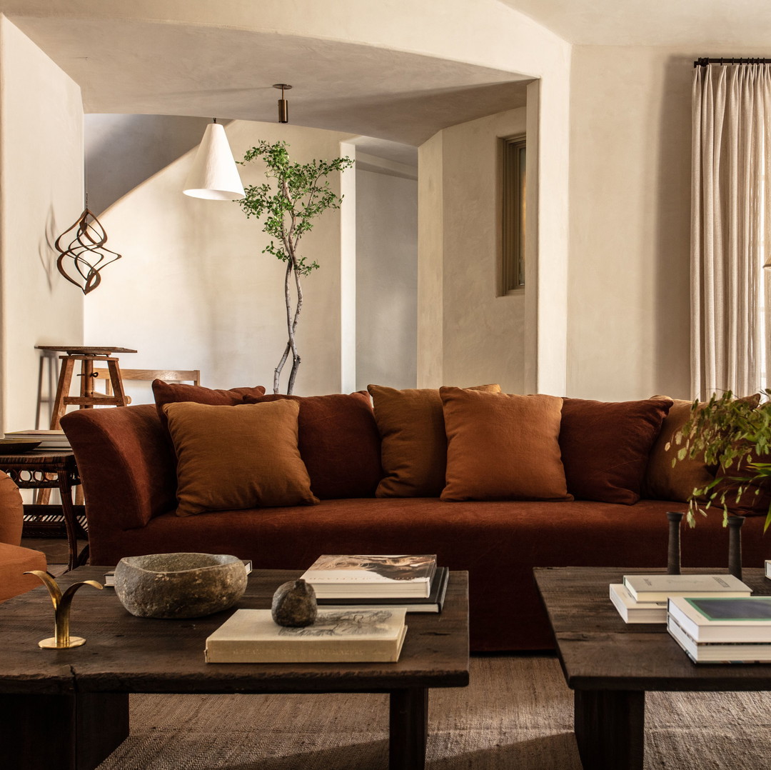 a living room filled with furniture and a large window