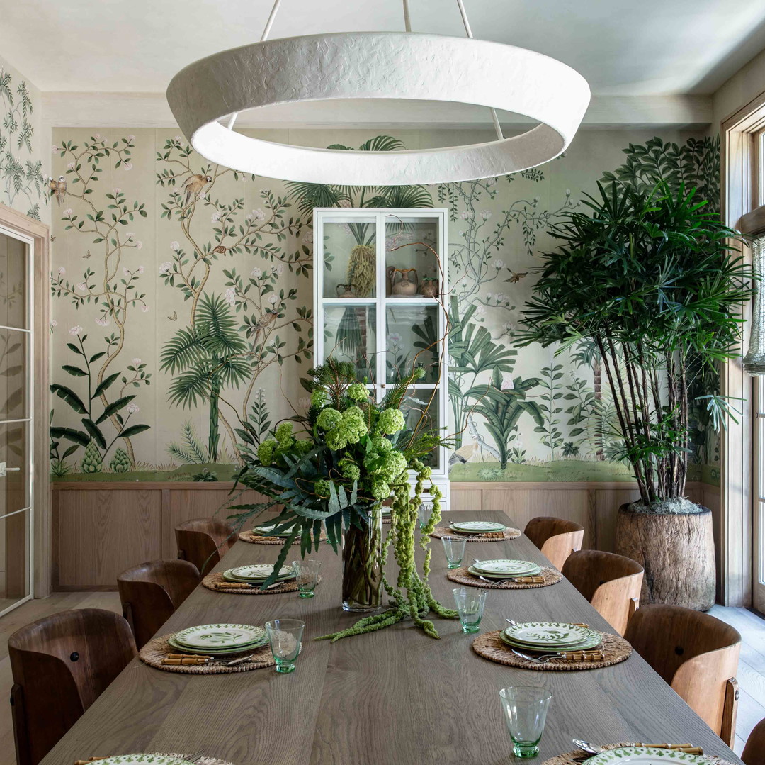 a dining room with a table and chairs